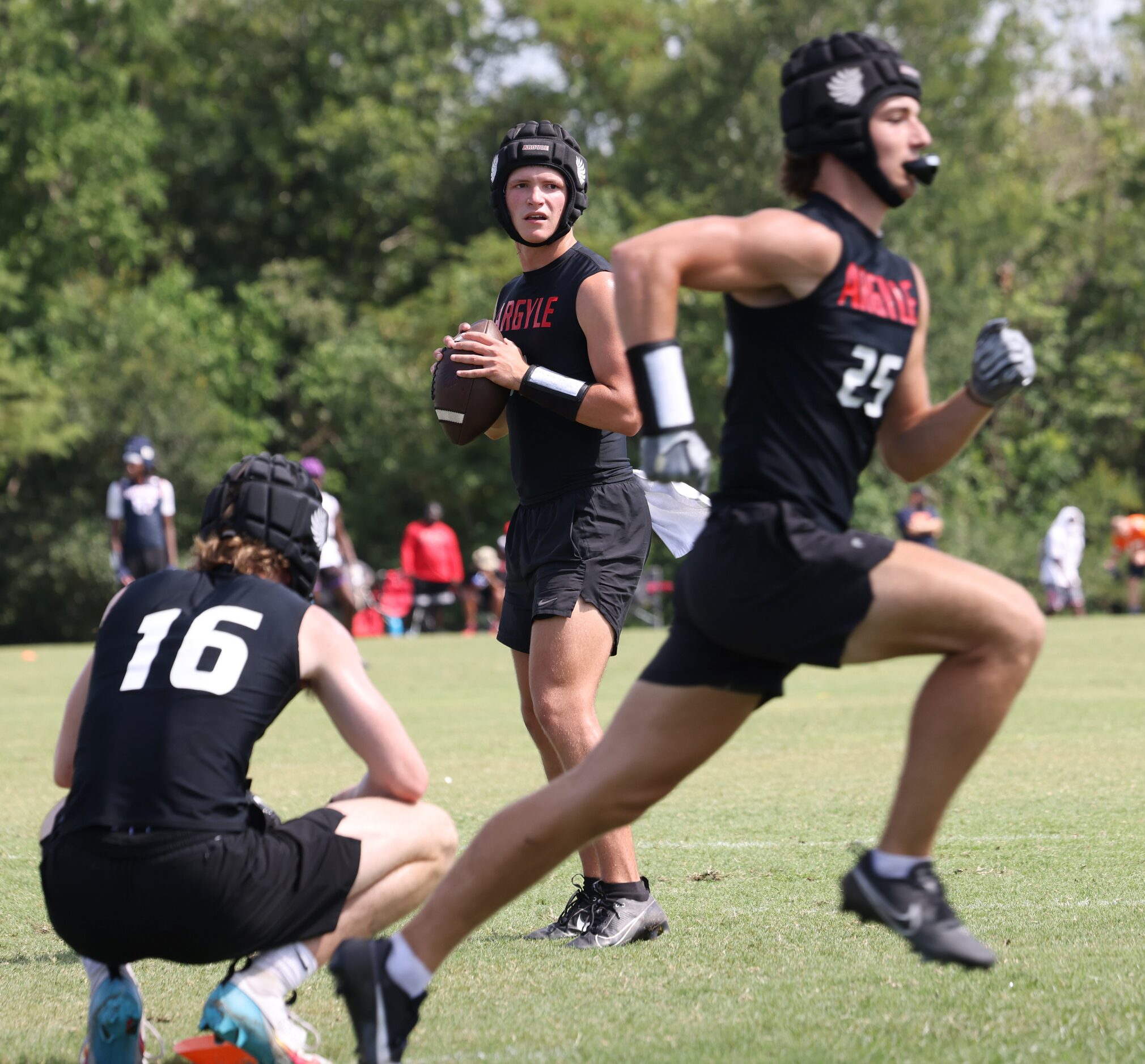 Argyle quarterback Maguire Gasperson (11) looks for a receiver during the first half of...