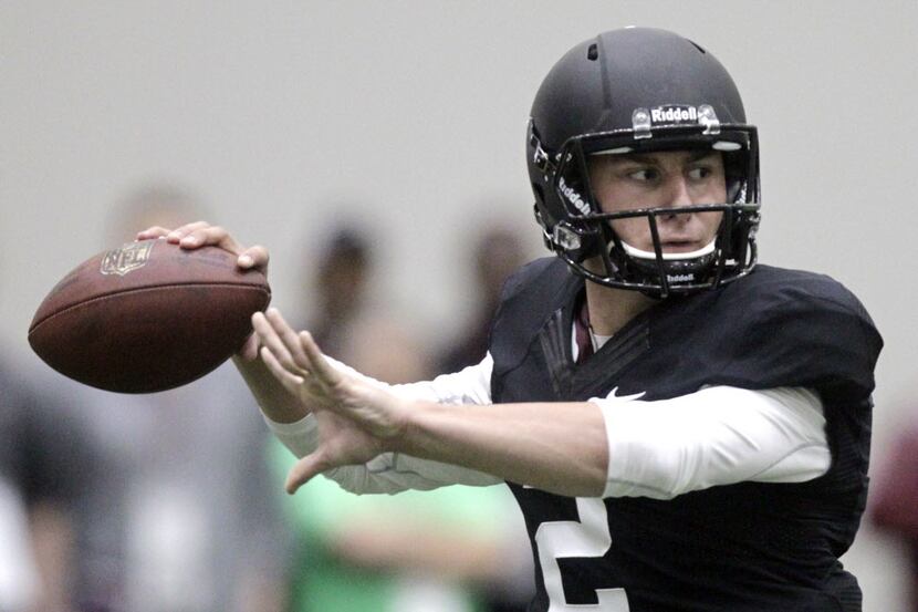 Texas A&M quarterback Johnny Manziel passes the ball during a drill at pro day for NFL...