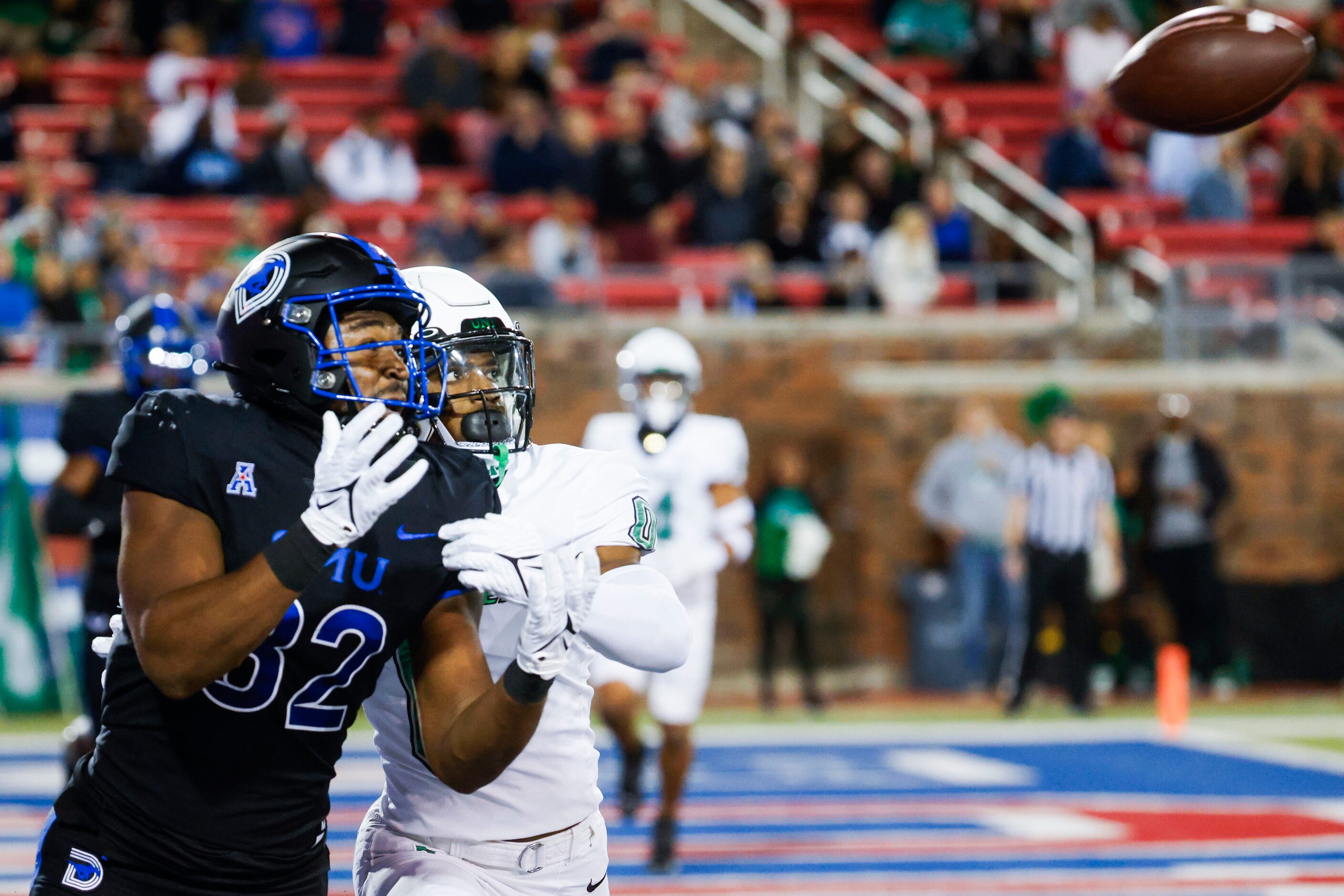 Southern Methodist Mustangs wide receiver Joey Bruszer (left) reaches to receive the ball...