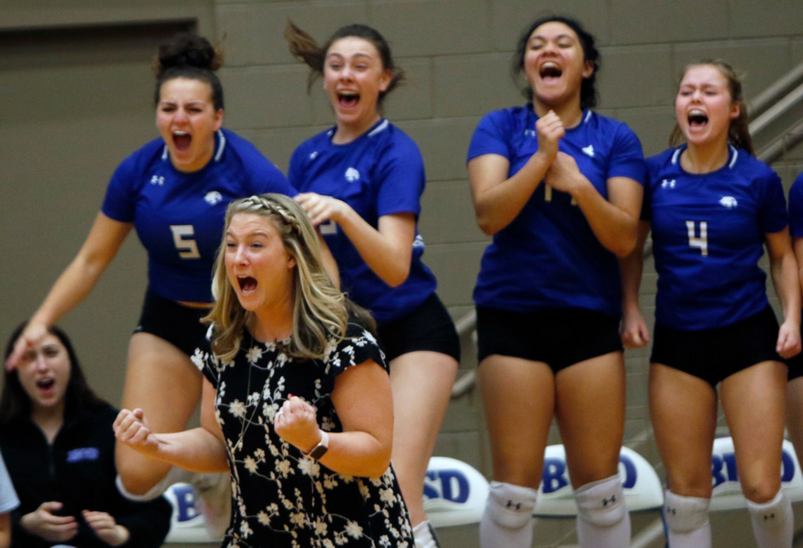 Trophy Club Byron Nelson head coach Brianne Barker-Groth exults as Lady Bobcats players take...