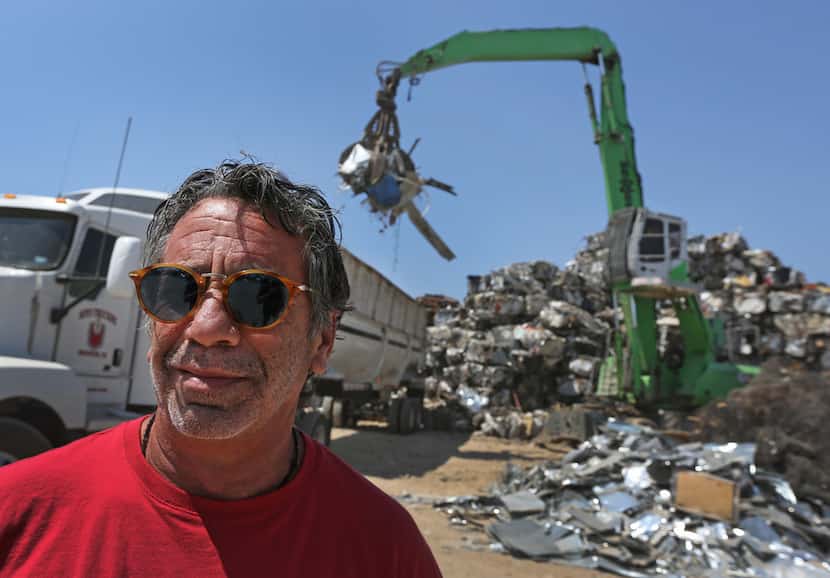  Laviage stands in the yard of his business, C&D Scrap Metal Recyclers in Houston.