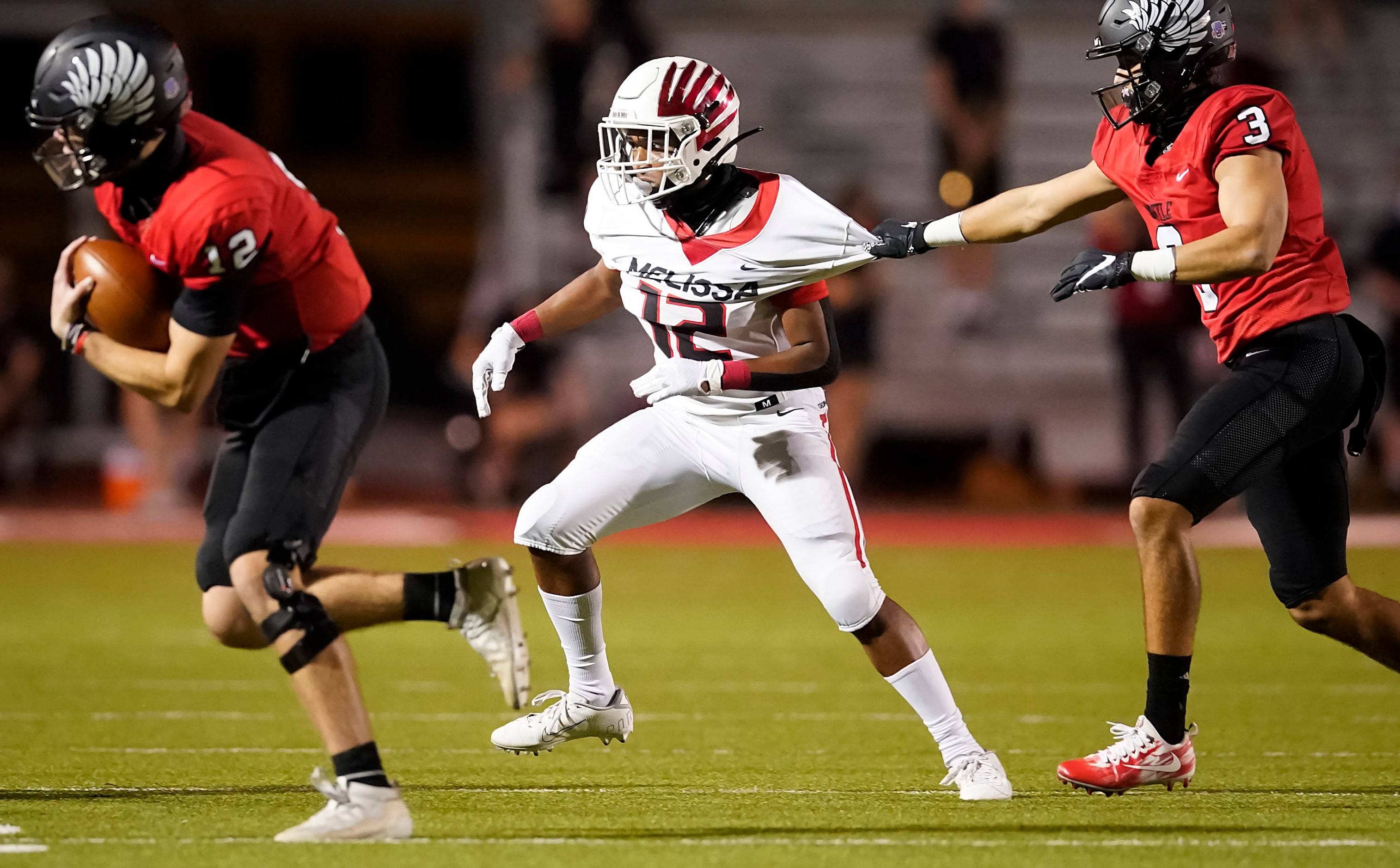 Argyle quarterback CJ Rogers (left) gets around Melissa defensive back Ashton...