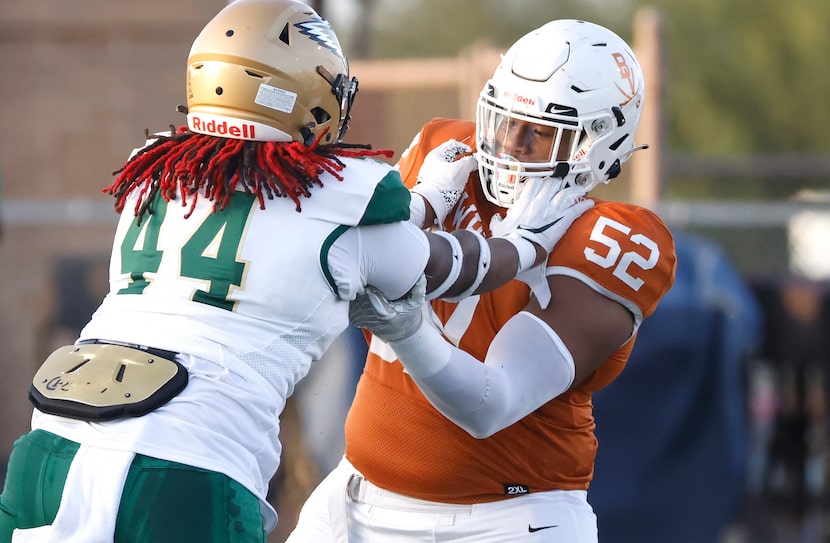 Arlington Bowie offensive lineman Devon Campbell (52) battles DeSoto defensive lineman...