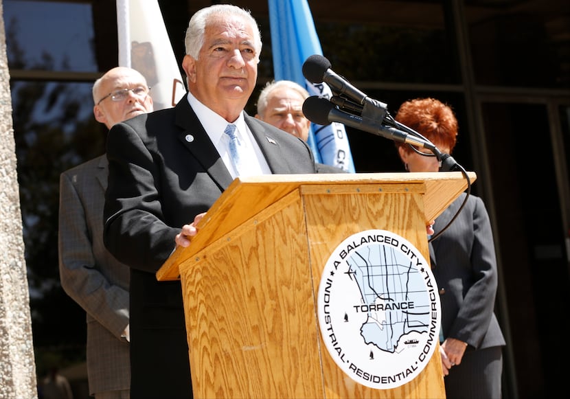 Torrance Mayor Frank Scotto, at podium, holds a news conference to discuss the announced...