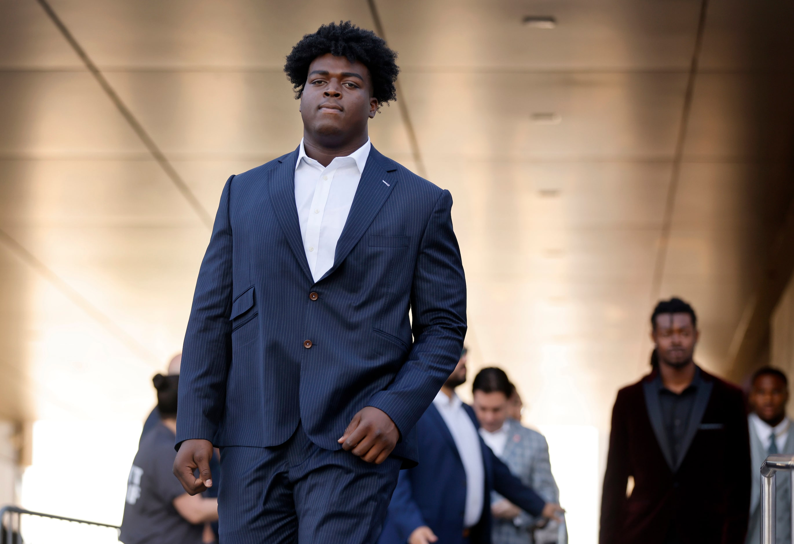 Dallas Cowboys offensive tackle Tyler Smith waves to fans as he arrives to the Dallas...