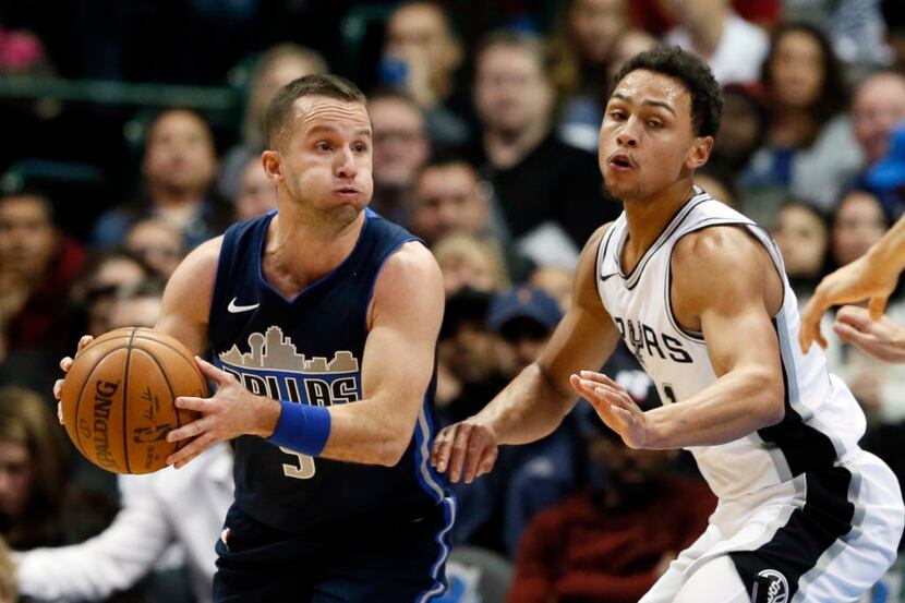 Dallas Mavericks guard J.J. Barea (5) of Puerto Rico looks to make a pass as San Antonio...