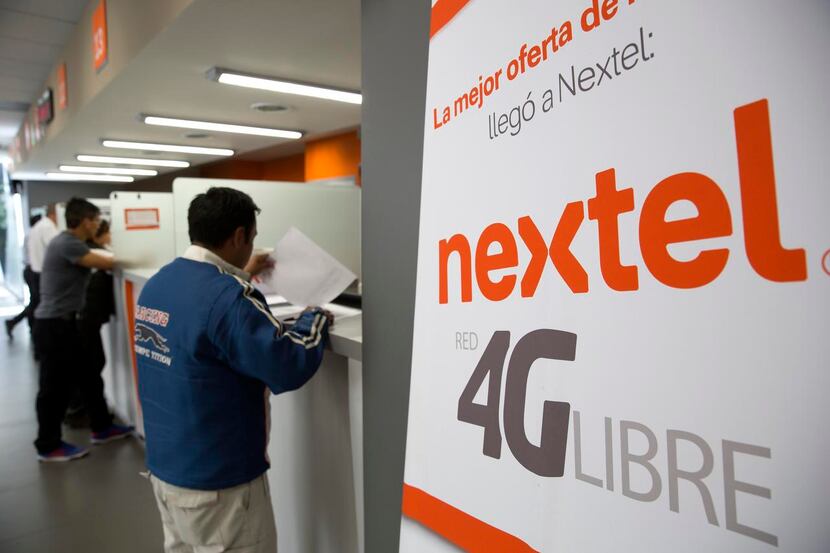 
Customers get assistance at a Nextel Mexico store in Mexico City. Wireless broadband...