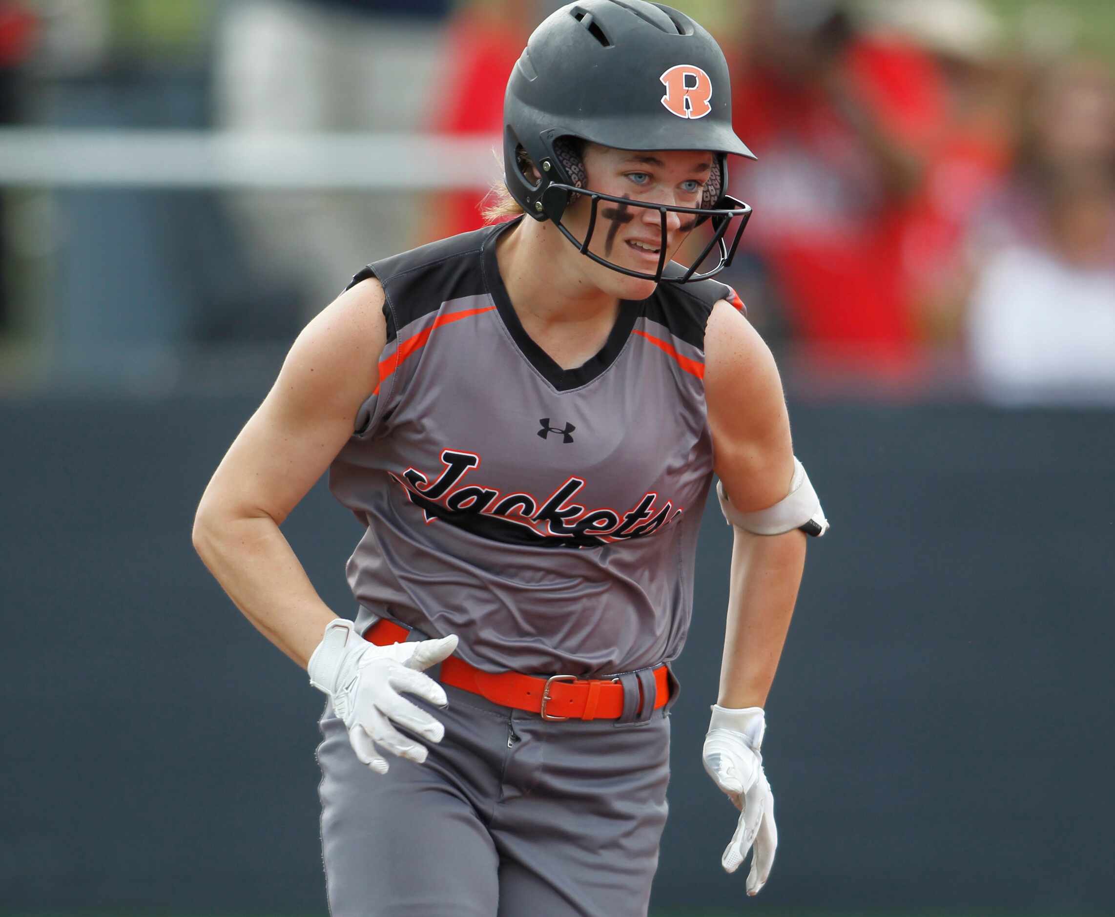 Rockwall's Logan Nies (6) hustles to first after laying down a bunt during the top of the...