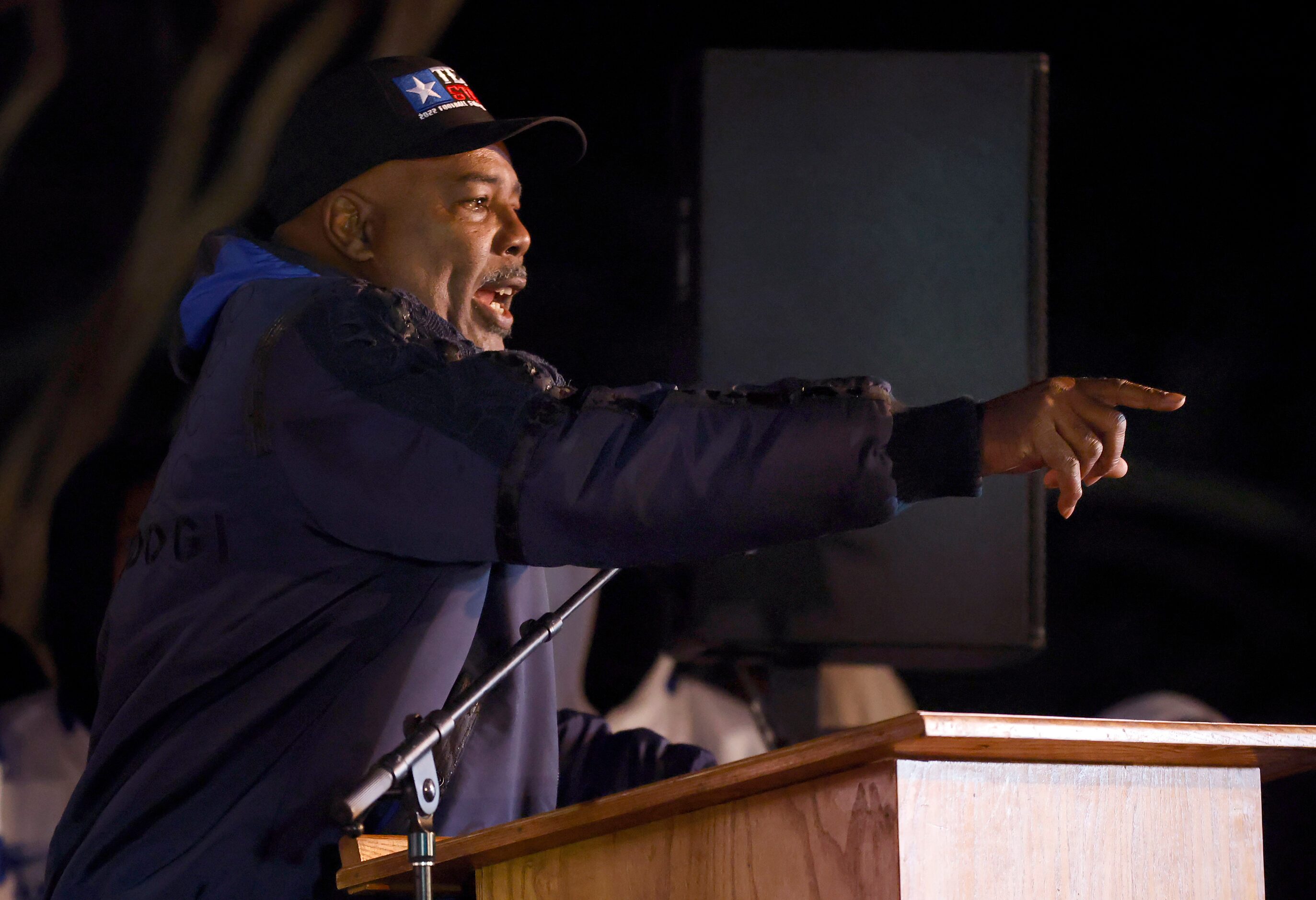 Head coach Reginald Samples points out his football team as he spoke to students and parents...