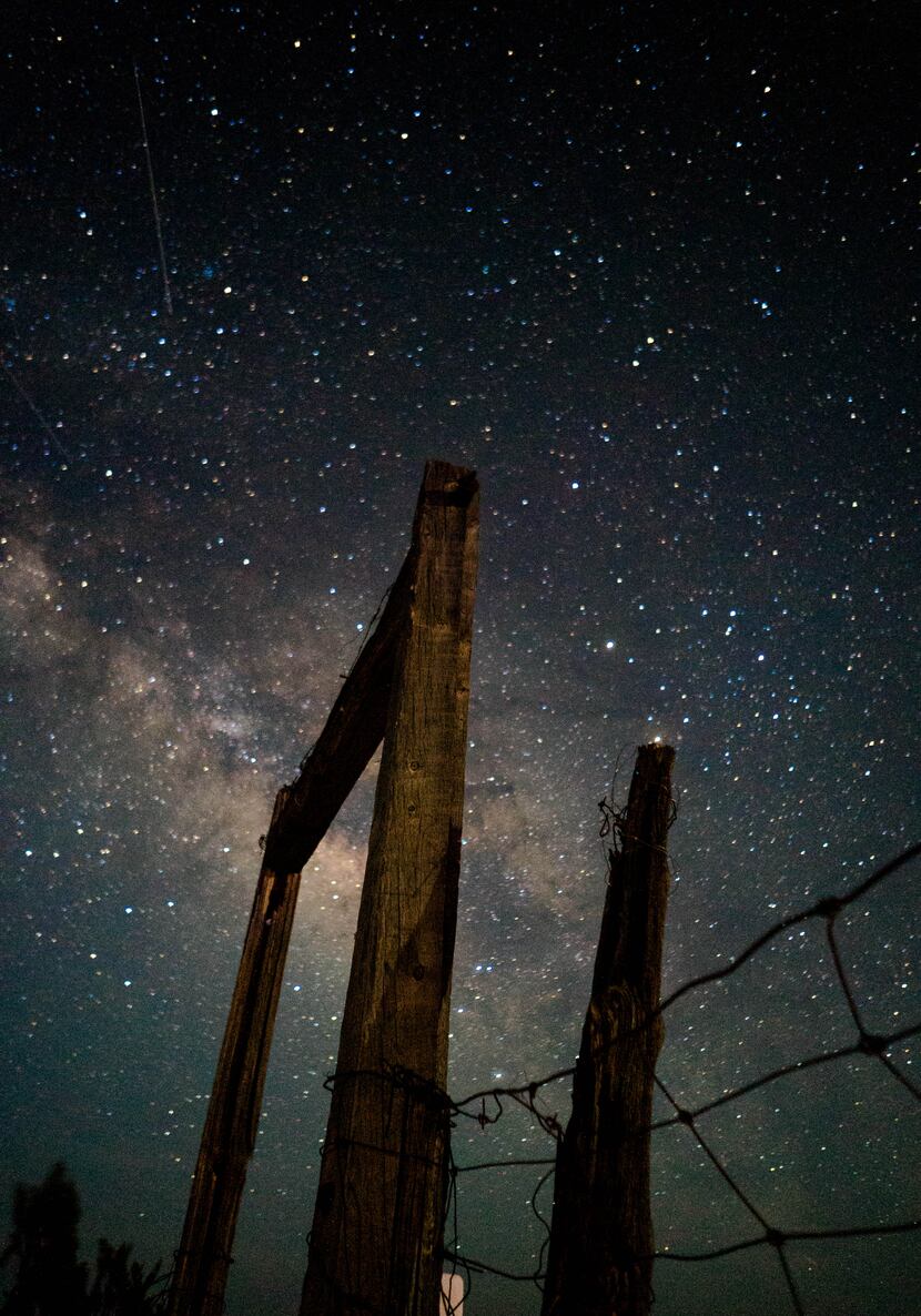 A shot of the stars over a fence in Big Bend National Park.