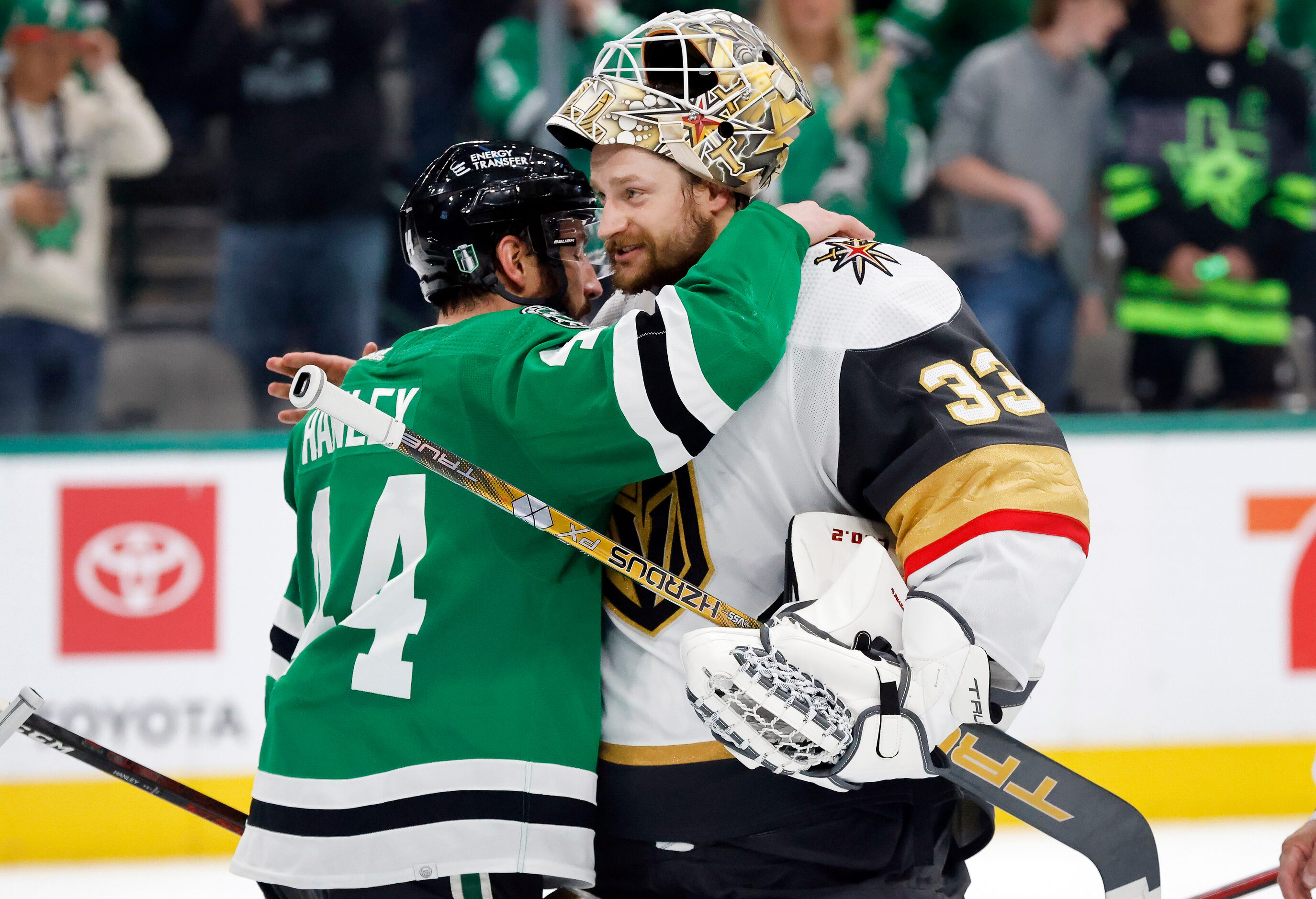 Vegas Golden Knights goaltender Adin Hill (33) receives a congratulatory hug from Dallas...