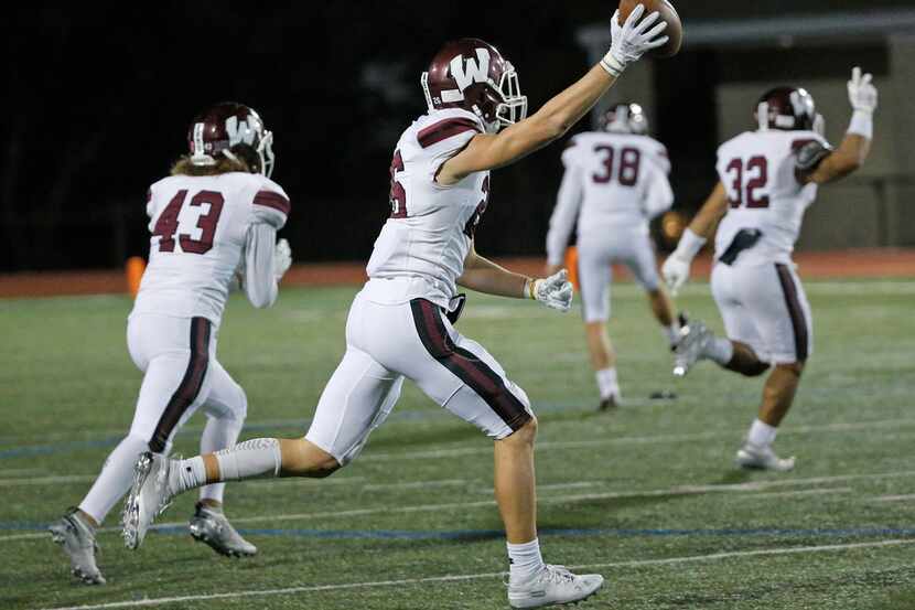 Wylie's Jamie Marlin (26) celebrates recovering an onside kick in the fourth quarter during...