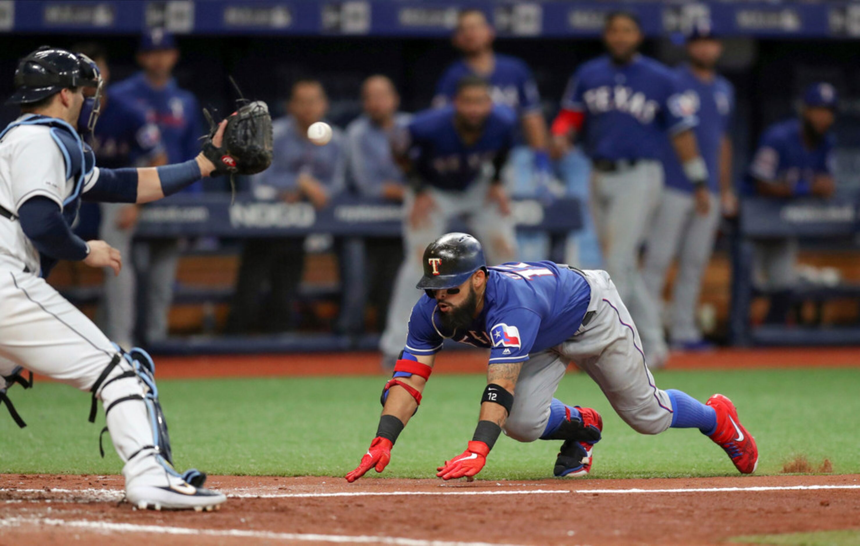 Tampa Bay Rays catcher Mike Zunino waits for the throw as Texas Rangers' Rougned Odor slides...