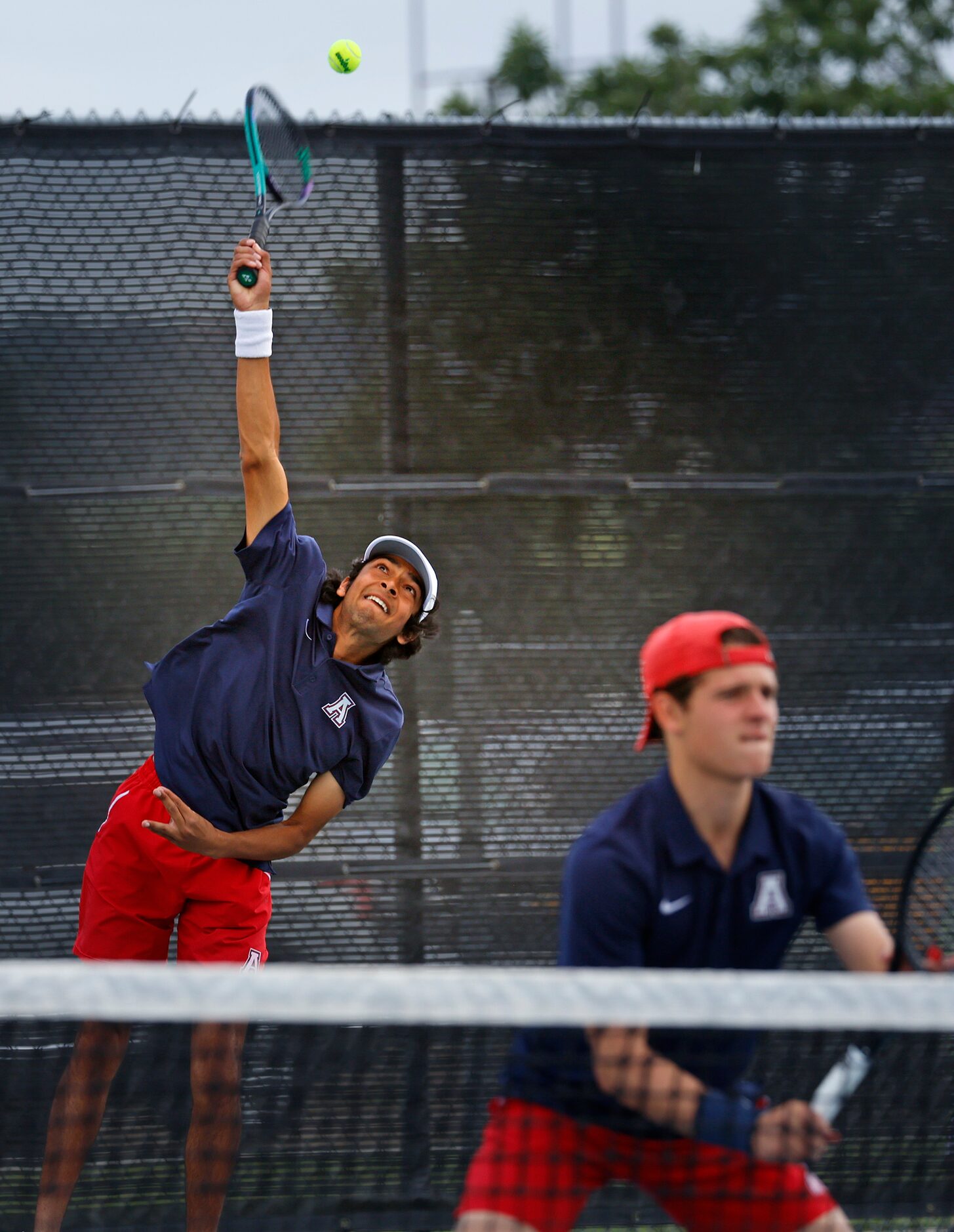 In Class 6A boys doubles Allen’s Tejas Ram serves as  Noah Hakim prepares for a return...