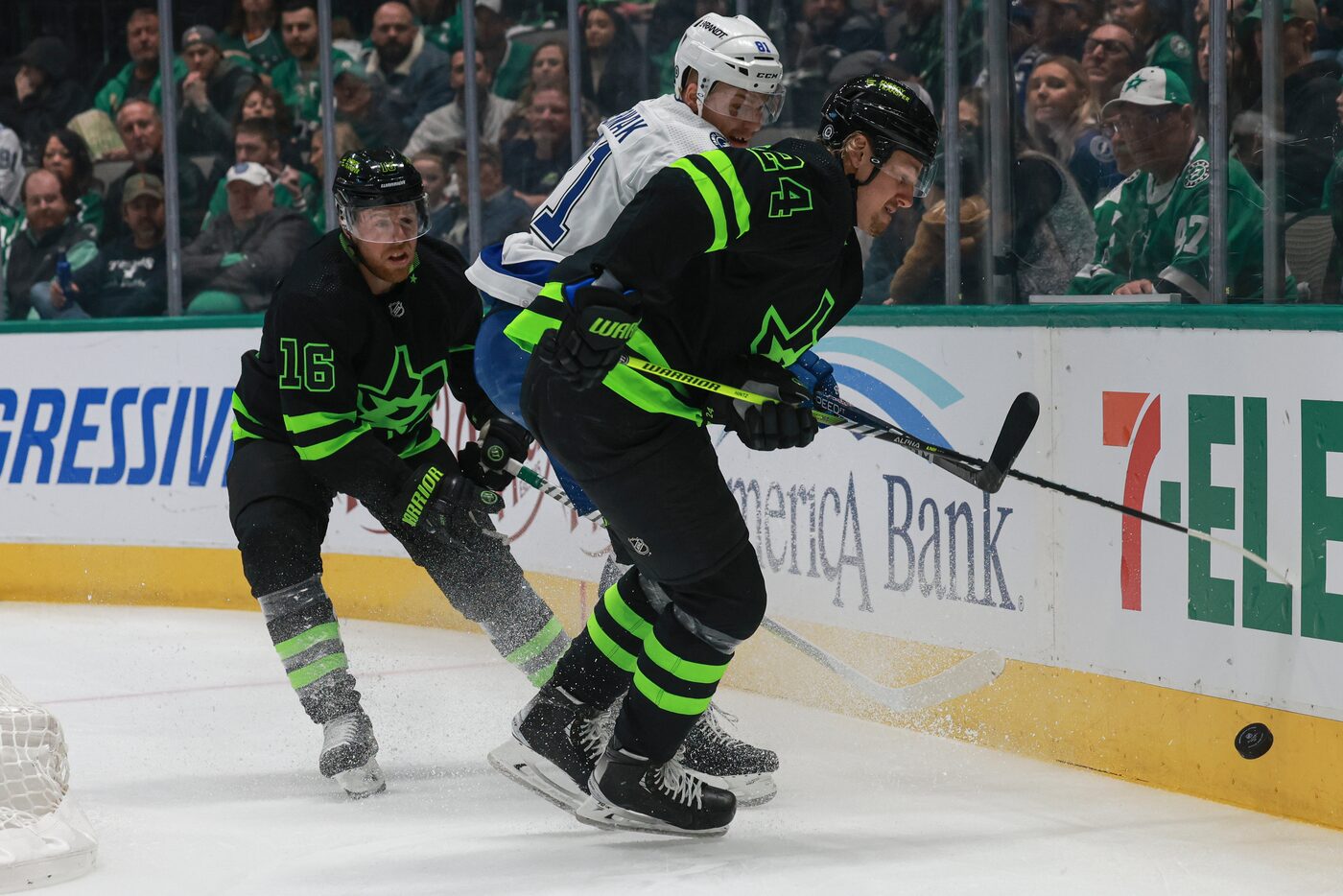 Tampa Bay Lightning defenseman Erik Cernak (81) chips the puck past Dallas Stars center...