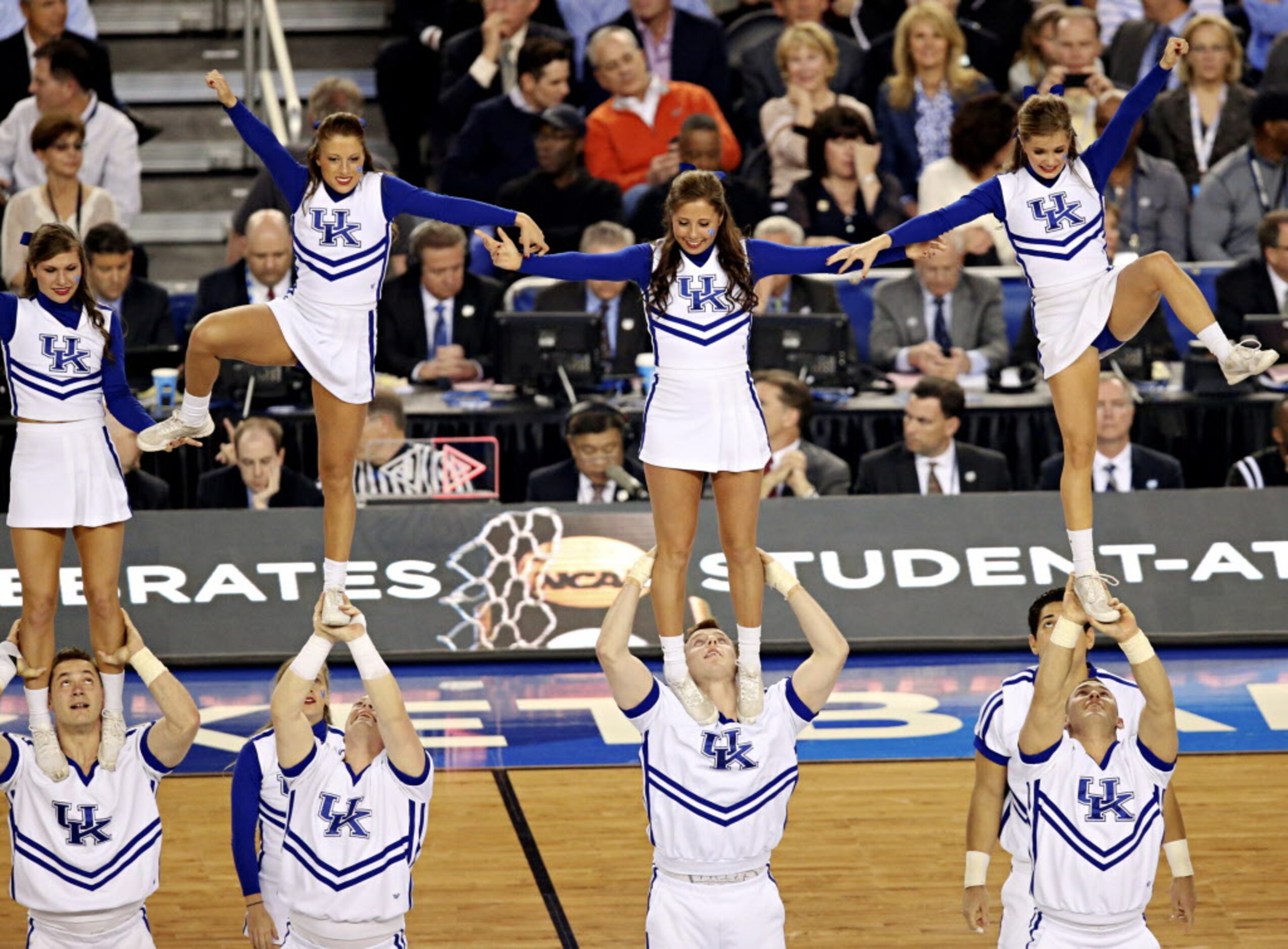 Members of the Kentucky Wildcats cheer squad perform during a time out in the first half of...