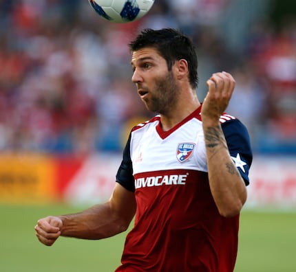 FC Dallas midfielder Ryan Hollingshead (12) started his first home game this season and gets...