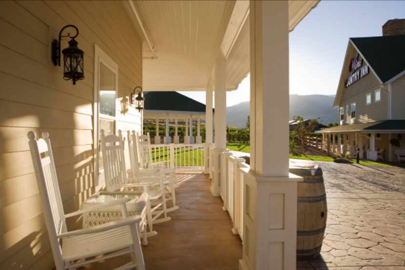 Couples can relax on the porch at Wine Country Inn, or take wine trips to neighboring...