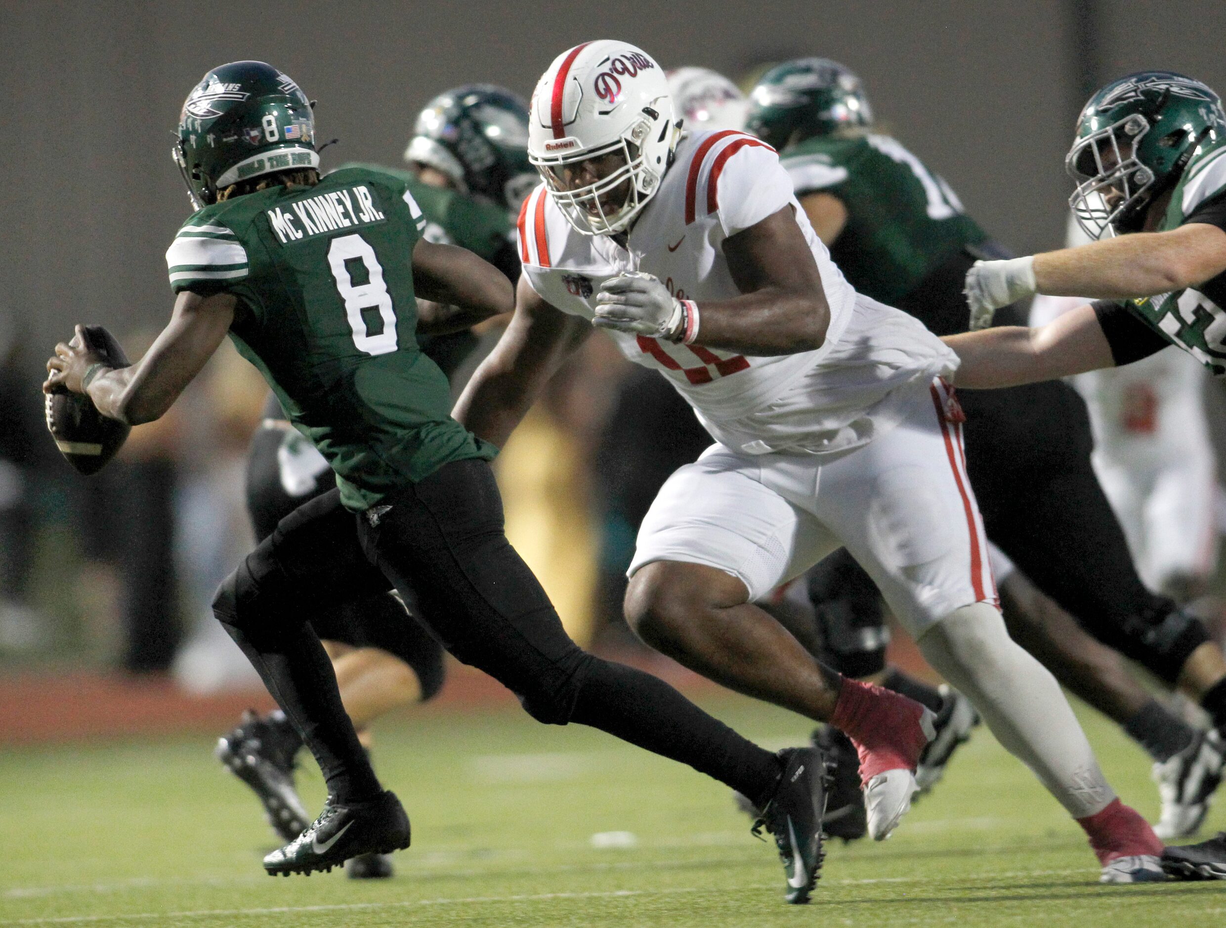 Waxahachie quarterback Ramon McKinney Jr. (8) attempts to elude the defensive pursuit of...