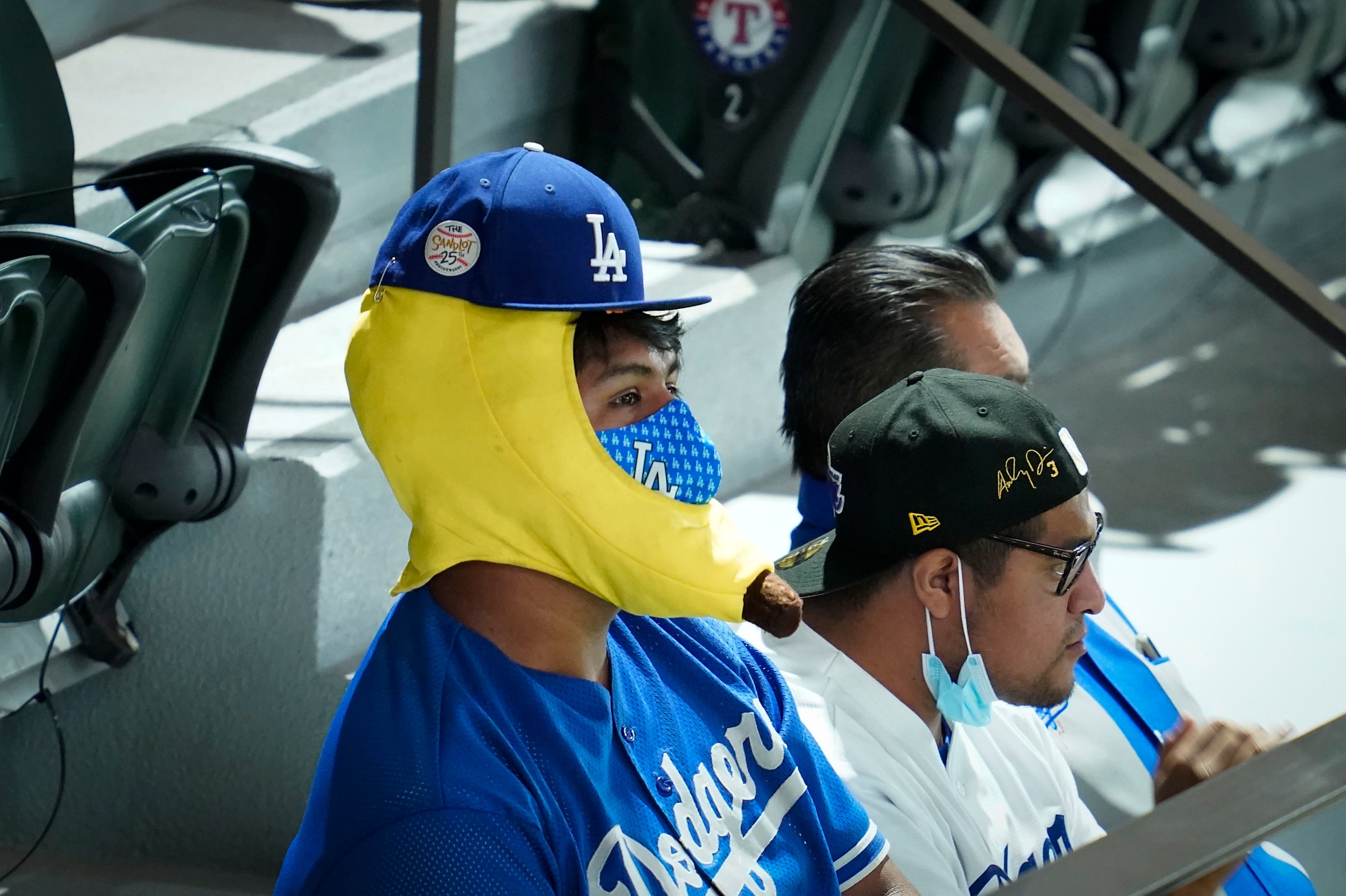 A Los Angeles Dodgers fan watches from the upper concourse in right field during first...