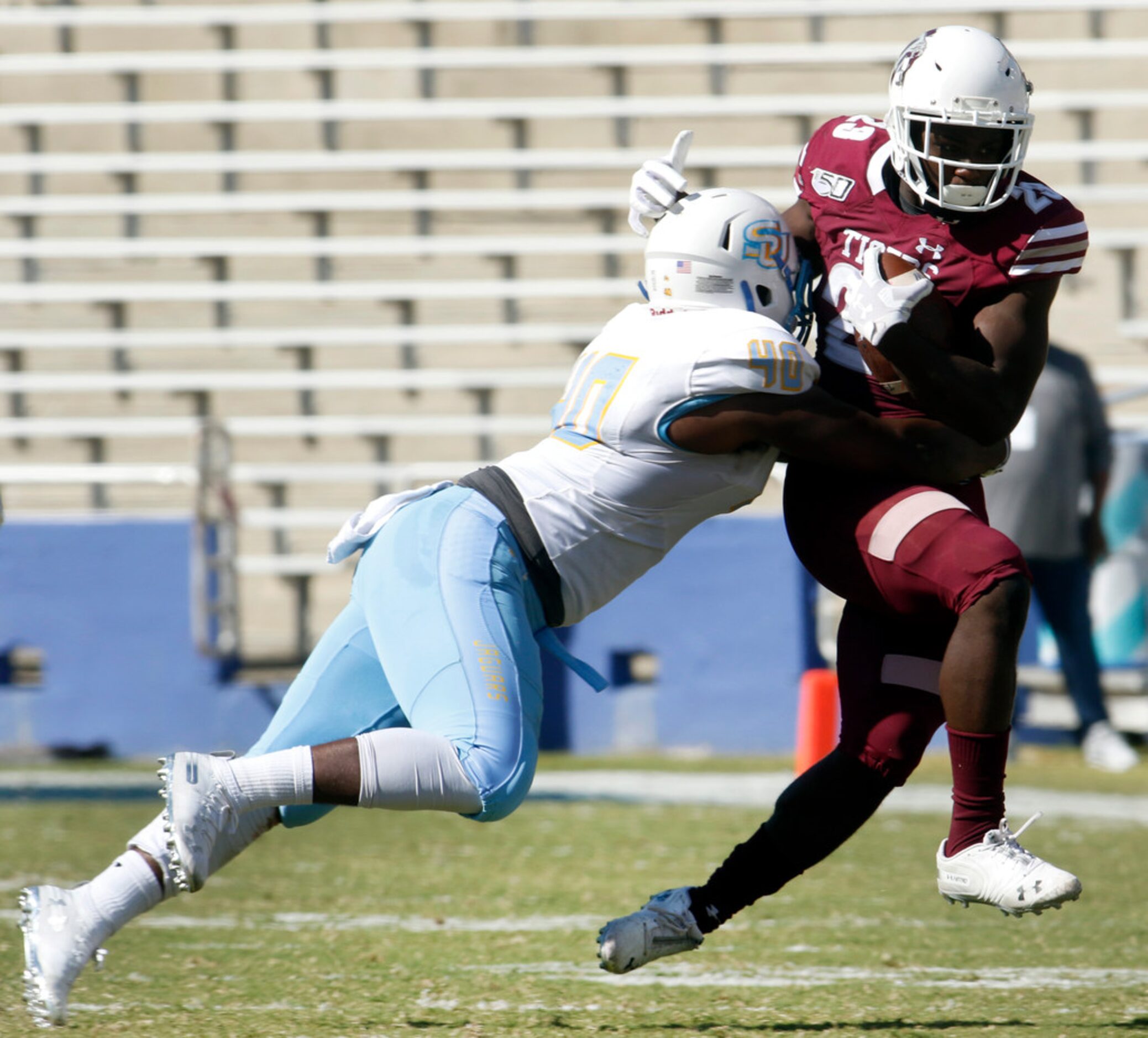 Texas Southern running back Jacorey Howard (23) is tackled by Southern linebacker Jordan...