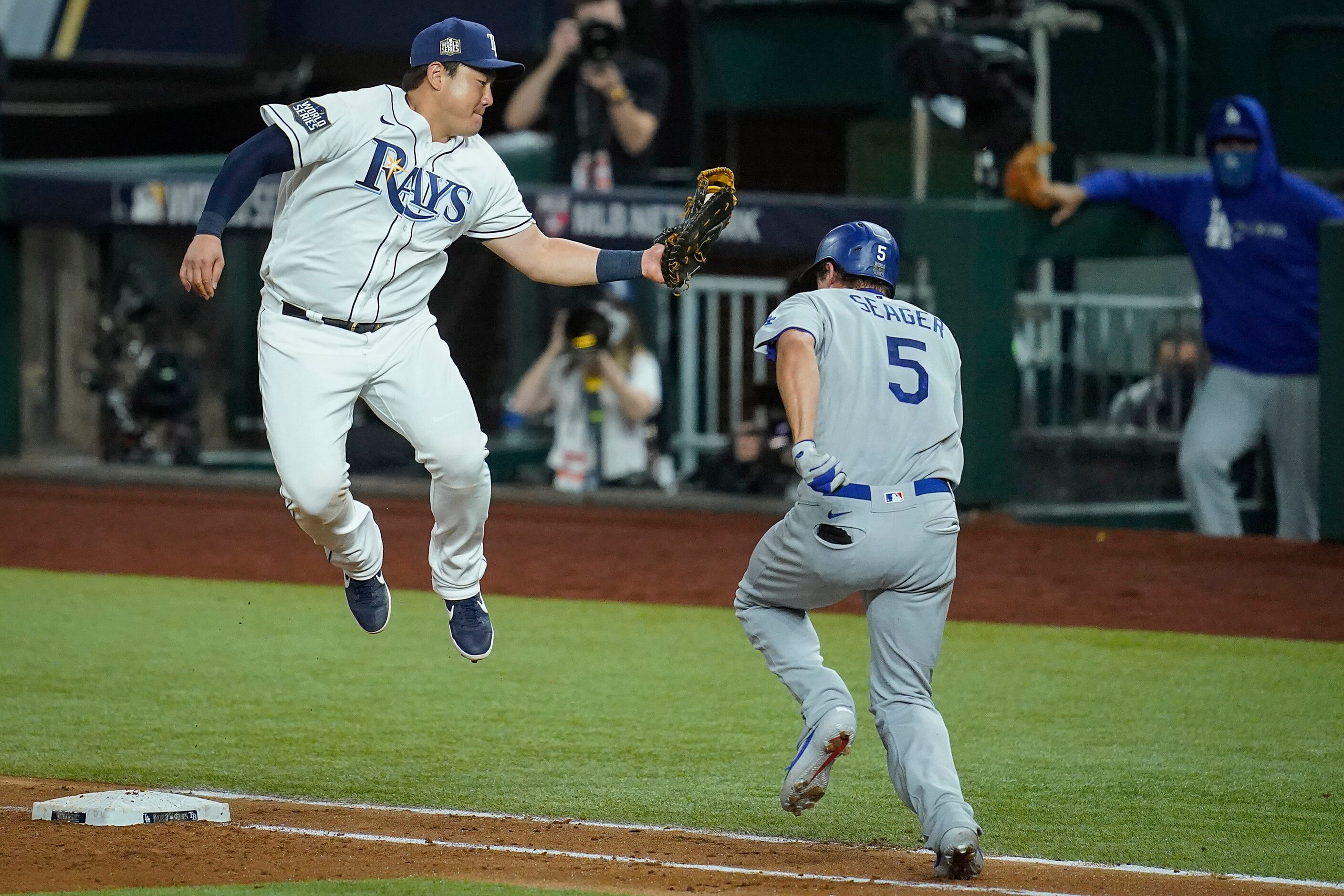 Tampa Bay Rays first baseman Ji-Man Choi makes a leaping catch and swipe to put the tag on...