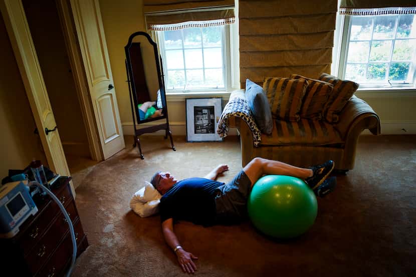 Michael Hoffman works out at home on the days when he doesn't have outpatient rehab at UT...