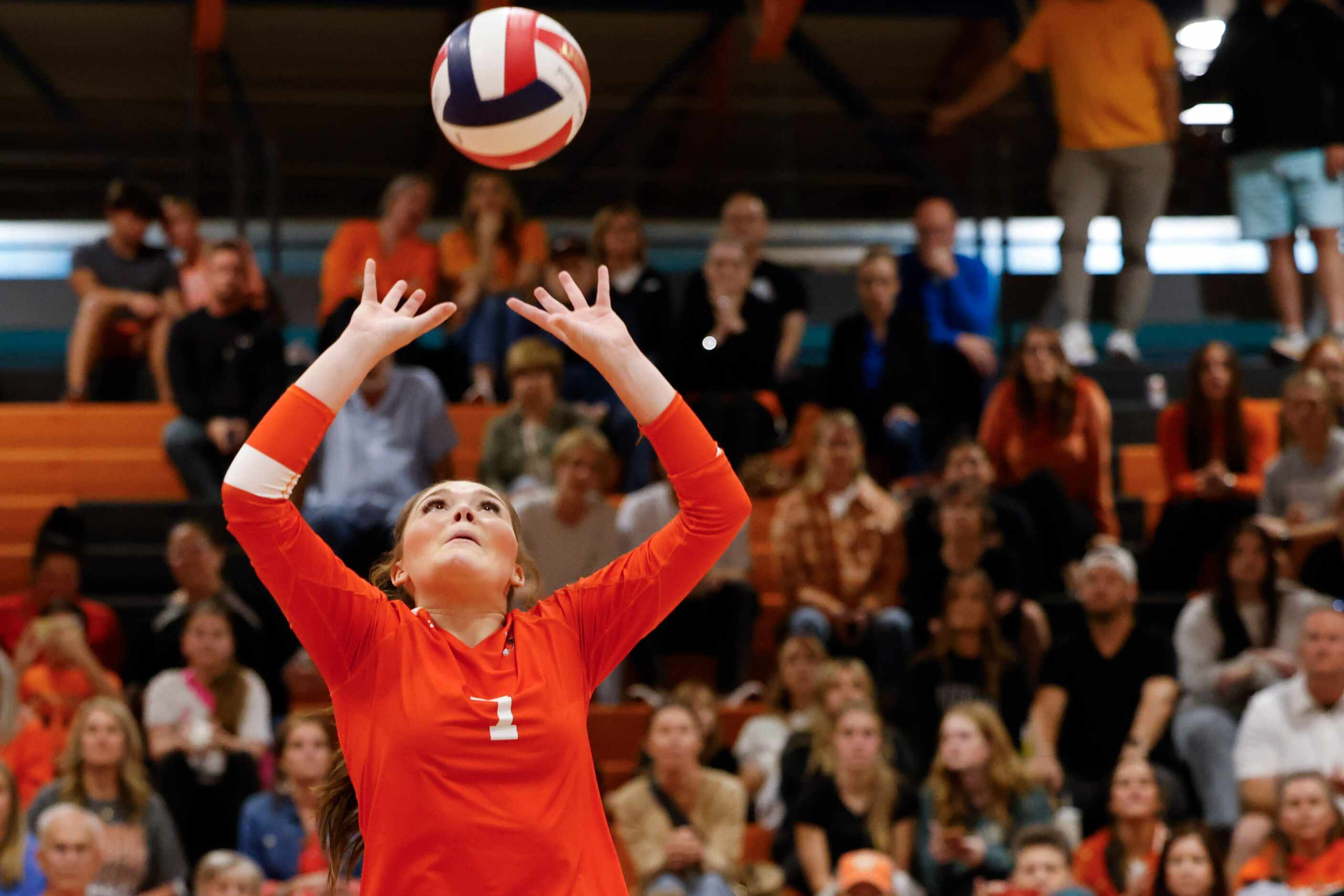 Rockwall high’s Gabi Ashcraft sets the ball during a volleyball game against Rockwall Heath...