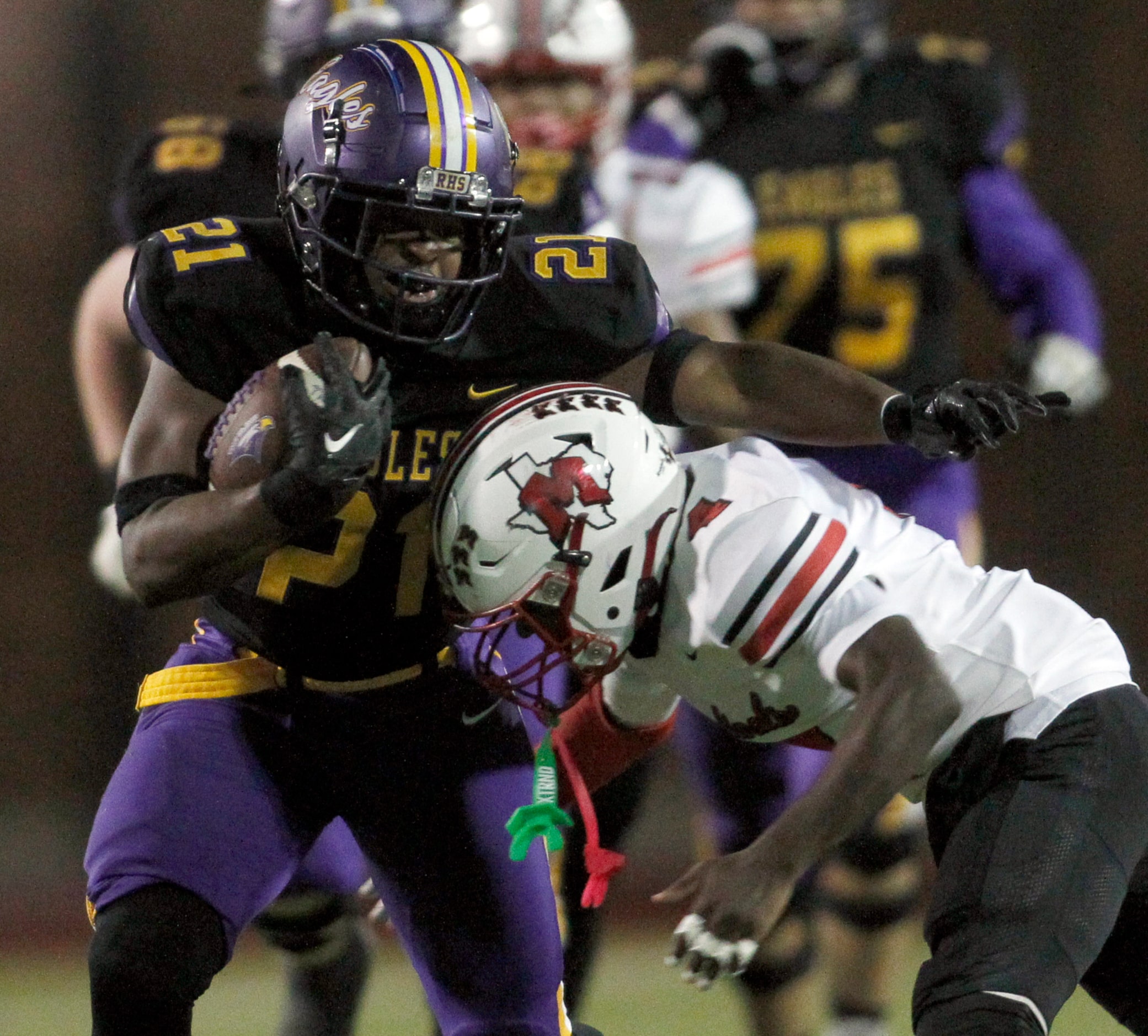 Richardson running back Kevin Willingham Jr. (21) is tackled by Irving MacArthur defensive...