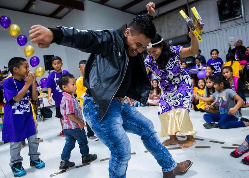 Tira Jorma dances with other immigrants from the Marshall Islands celebrate during a first...