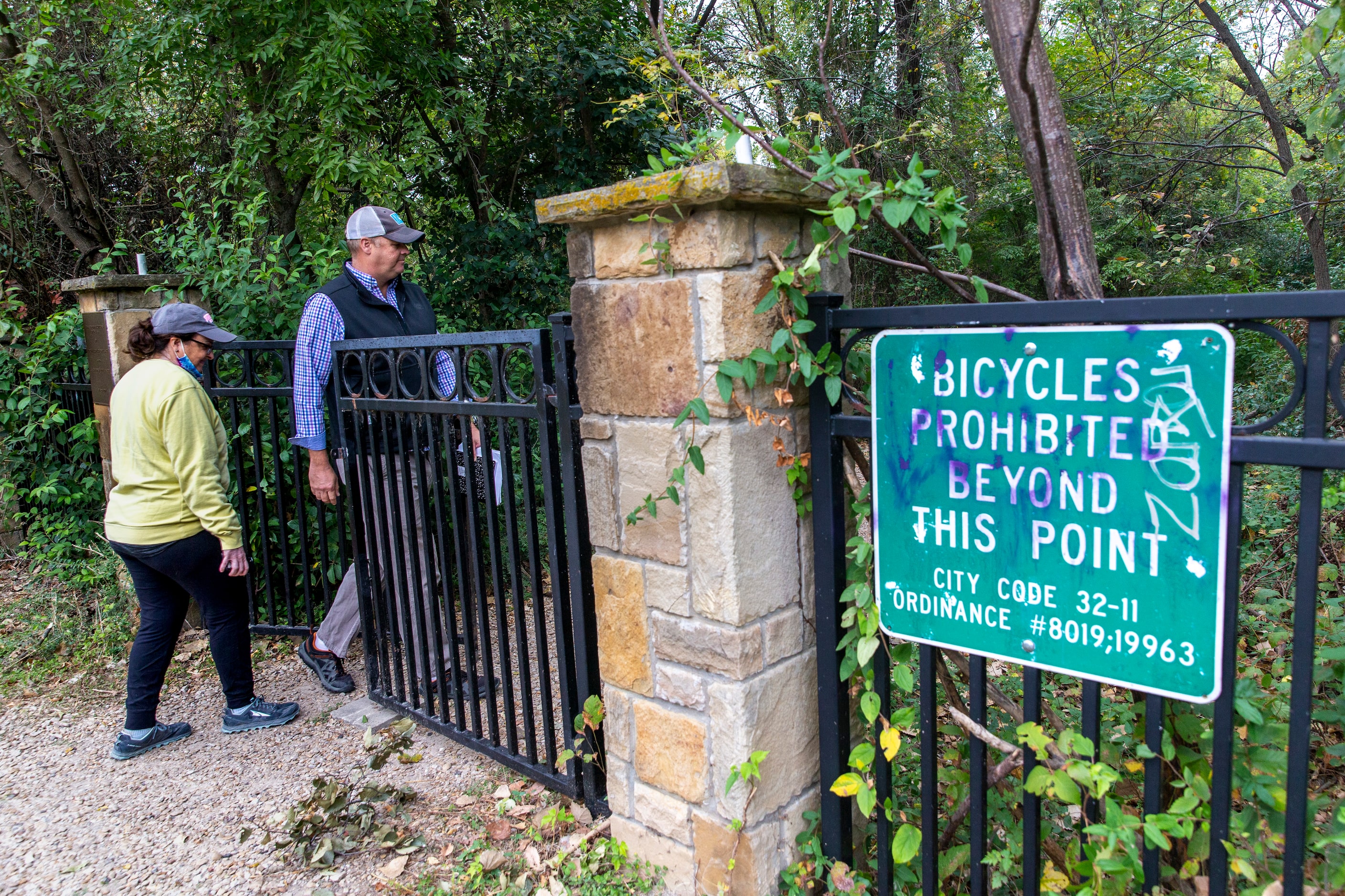 Master Naturalist Ben Sandifer (right) leads council member Paula Blackmon into the entrance...