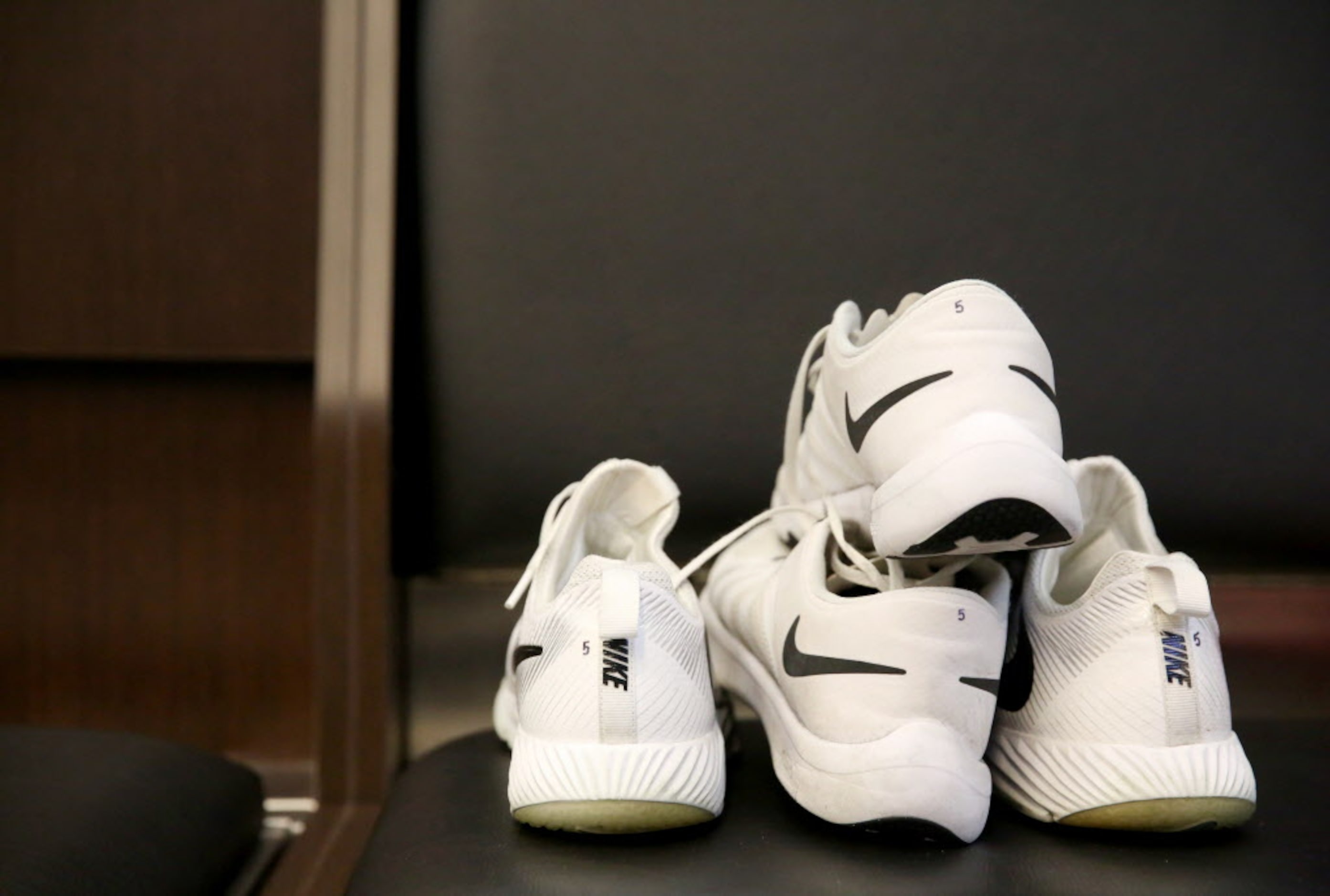 Dallas Cowboys kicker Dan Bailey's shoes at his locker at The Star in Frisco, Texas on Jan....