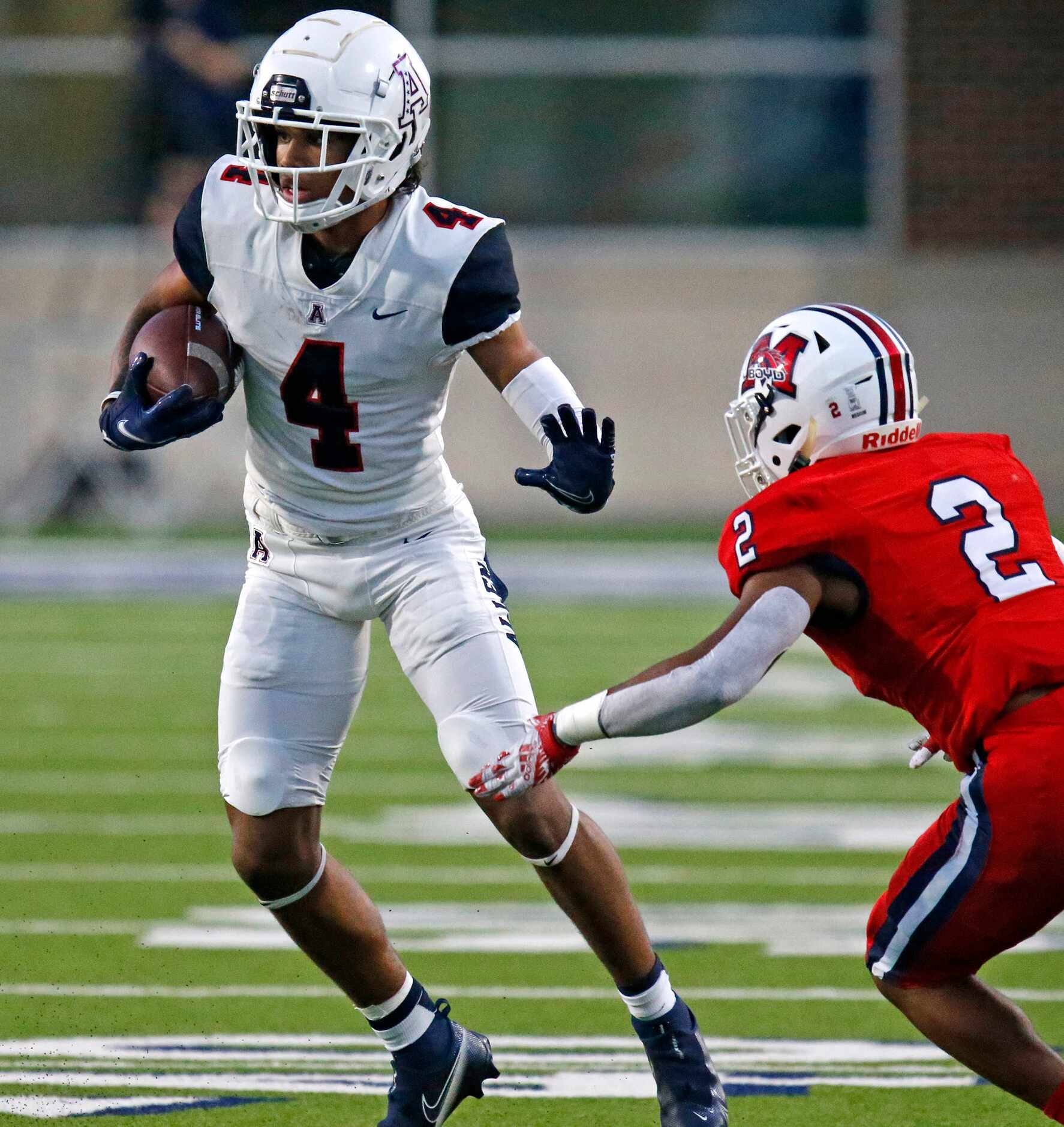 Allen High School wide receiver Jordyn Tyson (4) looks for room to run after catching a pass...
