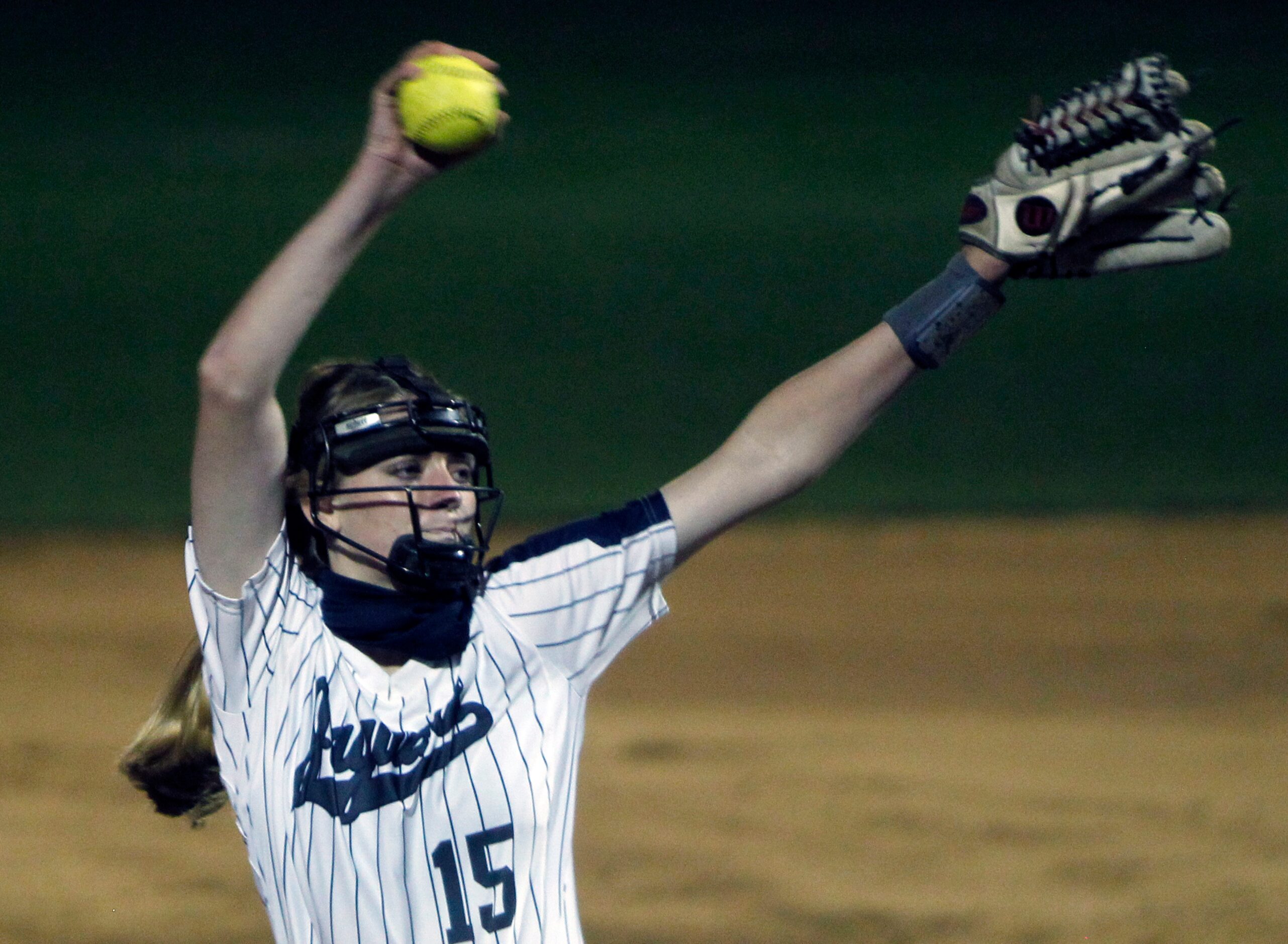 Flower Mound pitcher Landrie Harris (15) delivers a pitch to a Plano batter during the top...