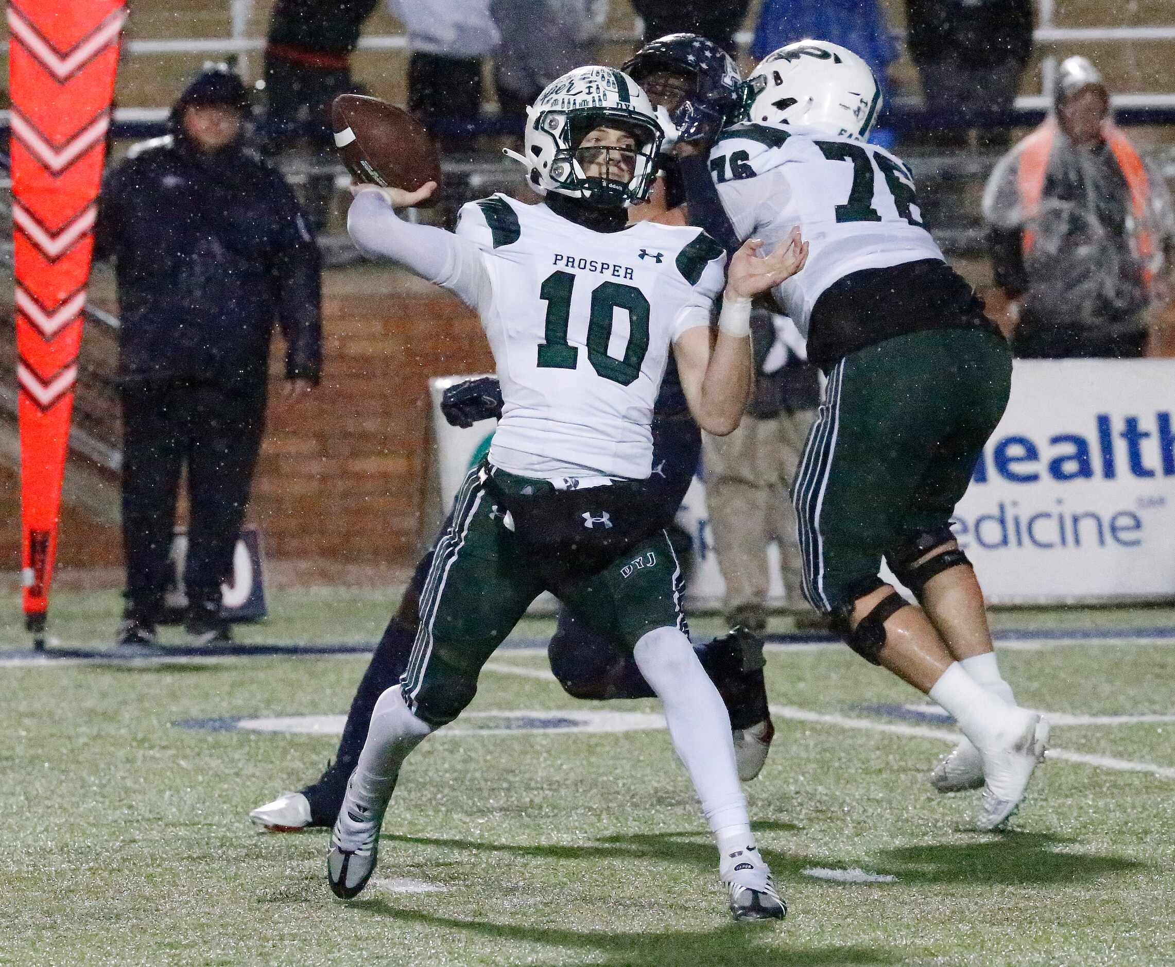 Prosper High School quarterback Harrison Rosar (10) throws a pass during the first half as...