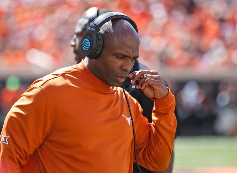 Texas head coach Charlie Strong walks along the sideline during an NCAA college football...