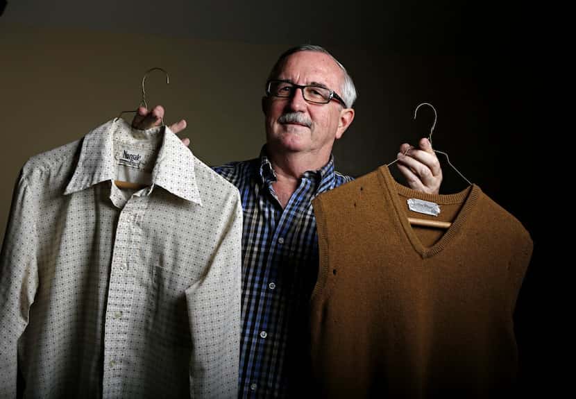 Dale Irby holds the 40-year-old dress shirt and sweater vest that helped launch the retired...