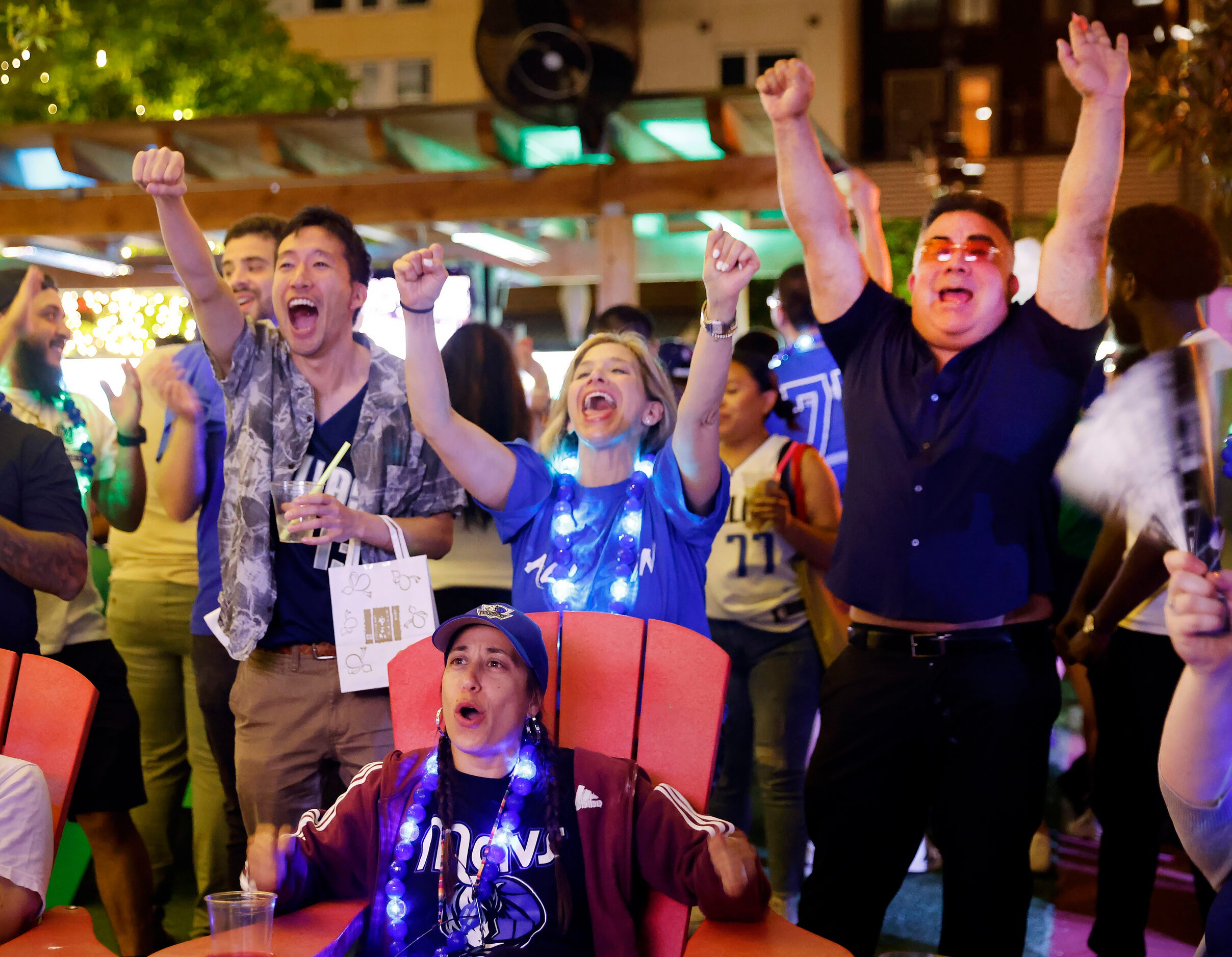 Dallas Mavericks fans (standing from left) Gaku Okada, Tania Bradkin and Michael Bosquez...