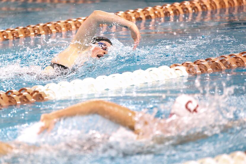 Southlake Carroll swimmer Natalie Whalen, top, maintains the lead in a 500 yard freestyle...