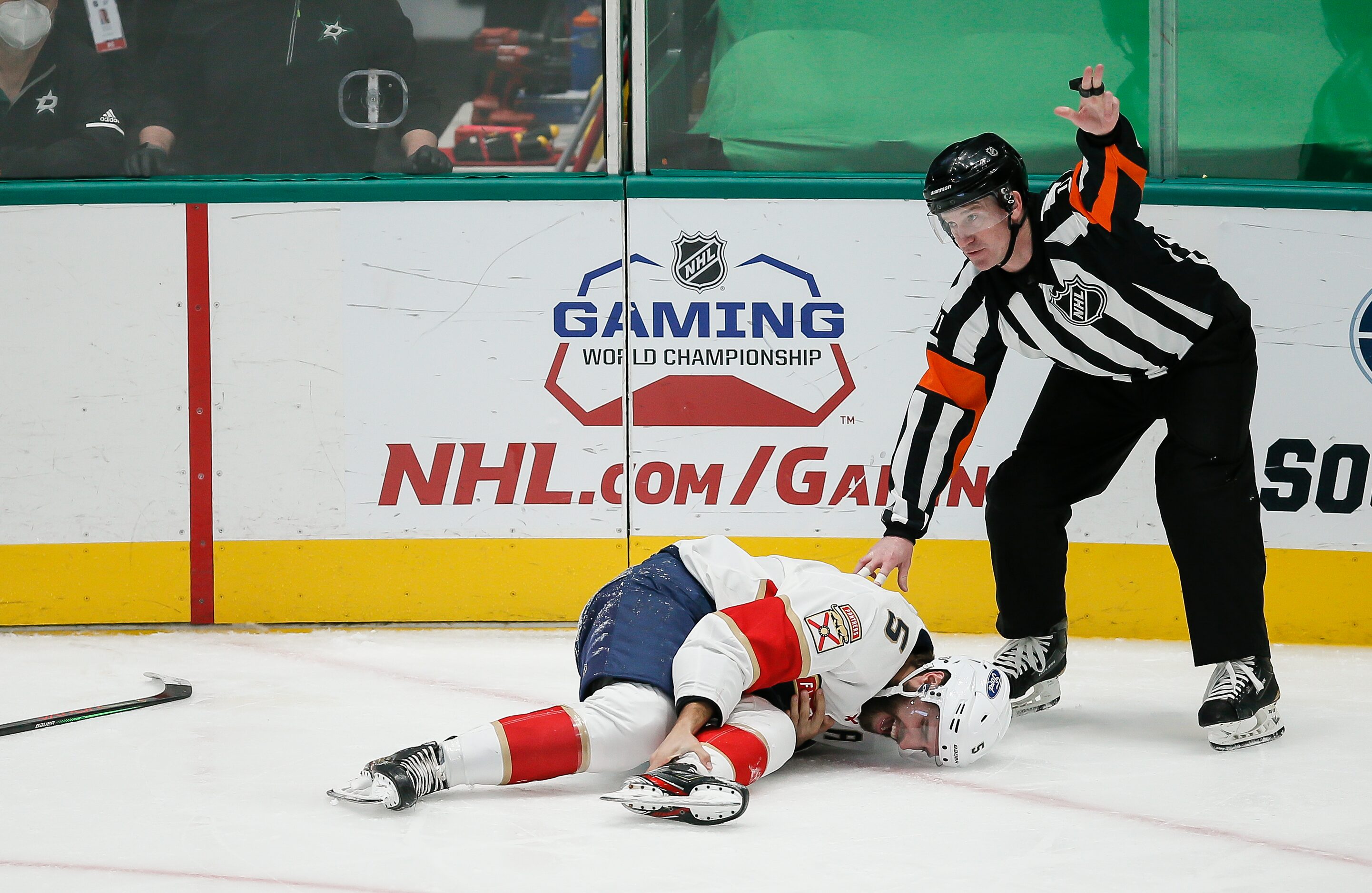 Referee Kelly Sutherland (11) calls for a trainer after Florida Panthers defenseman Aaron...