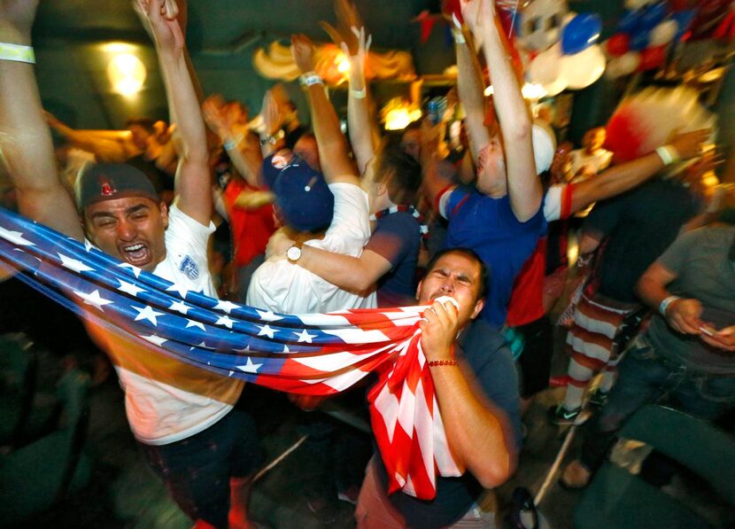 
Ruben Arevalo of Dallas kissed the flag Sunday after the U.S. women defeated Japan, 5-2,...