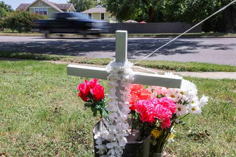 A makeshift memorial honoring Armando Leija near the intersection of West Jefferson...