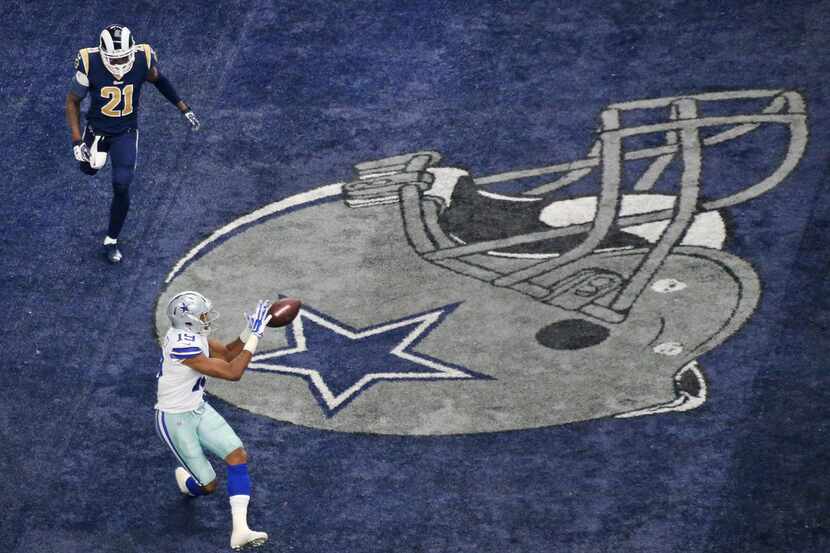 Dallas Cowboys wide receiver Brice Butler (19) catches a second-quarter touchdown pass in...