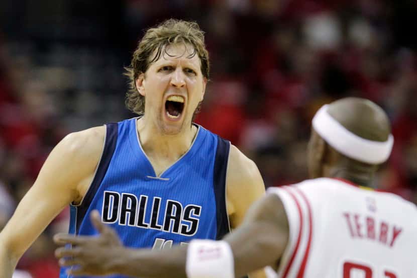 Dallas Mavericks forward Dirk Nowitzki (41) screams toward Houston Rockets guard Jason Terry...