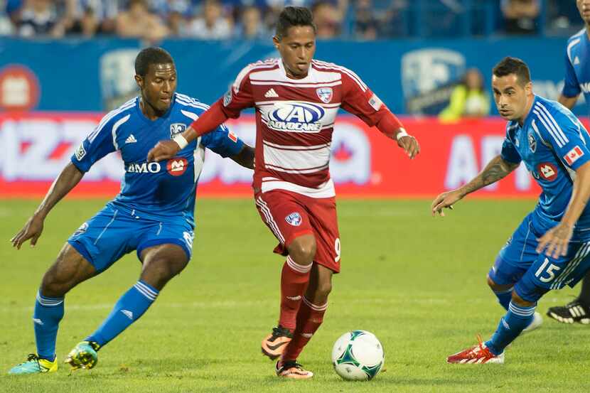 FC Dallas' Rafael breaks through Montreal Impact's defense as he advances with the ball...