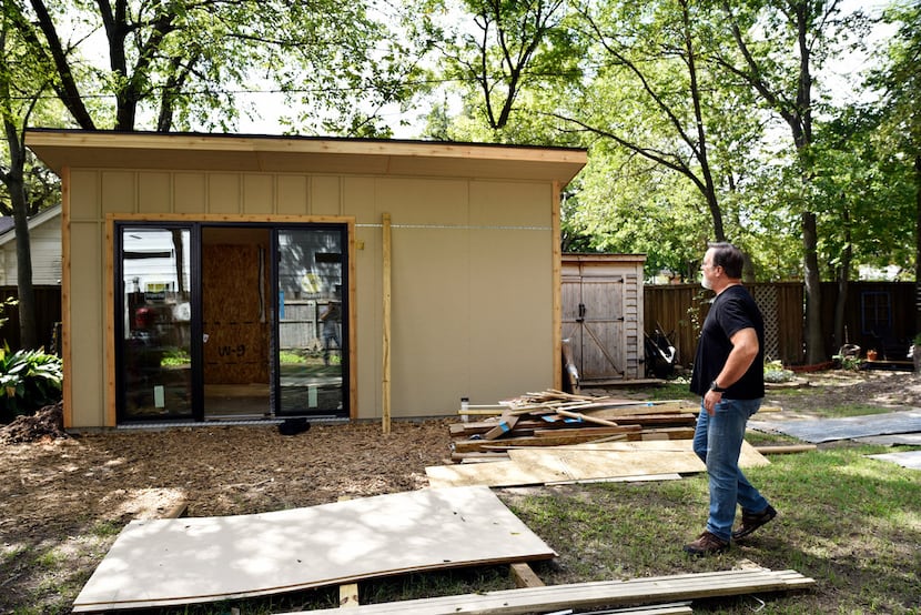 Jody Dean looks over the progress on what will become a studio in his backyard.