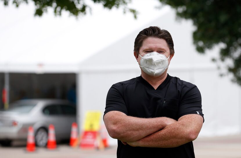 Devin Thornton, CEO of Honu Management Group poses for a photo at the drive-through COVID-19...