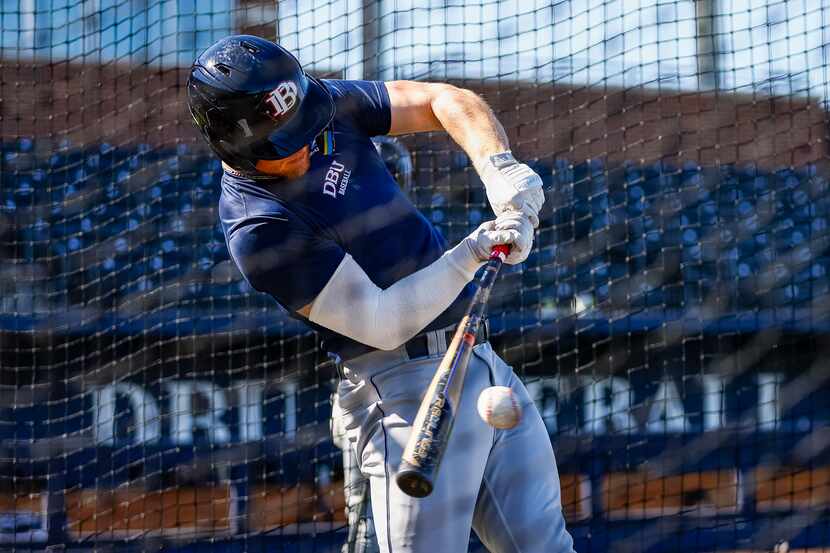 Dallas Baptist University freshman outfielder Ryan Scott connects during batting practice at...