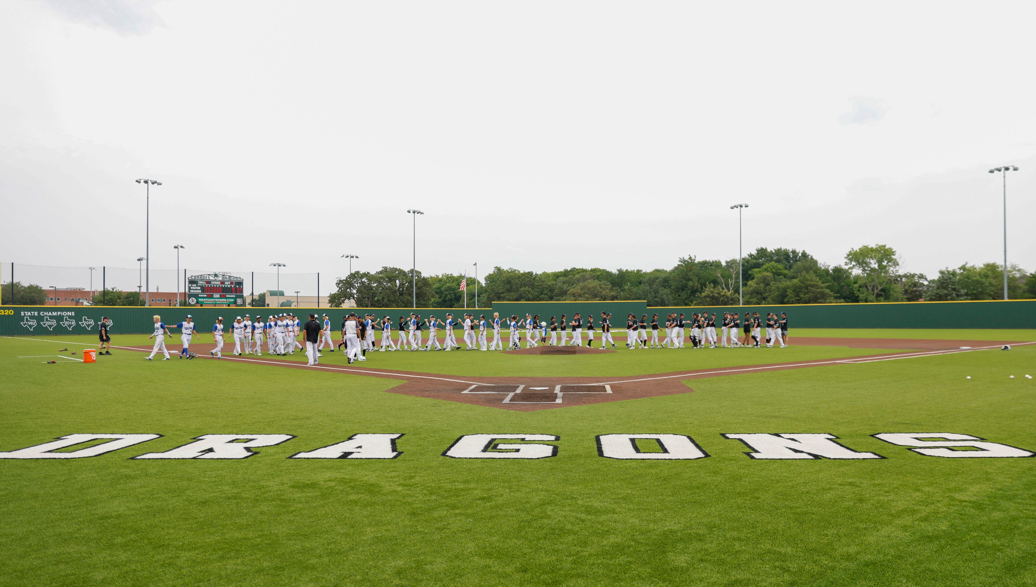 Denton Guyer players shakes hand after winning a baseball game against Byron Nelson High...