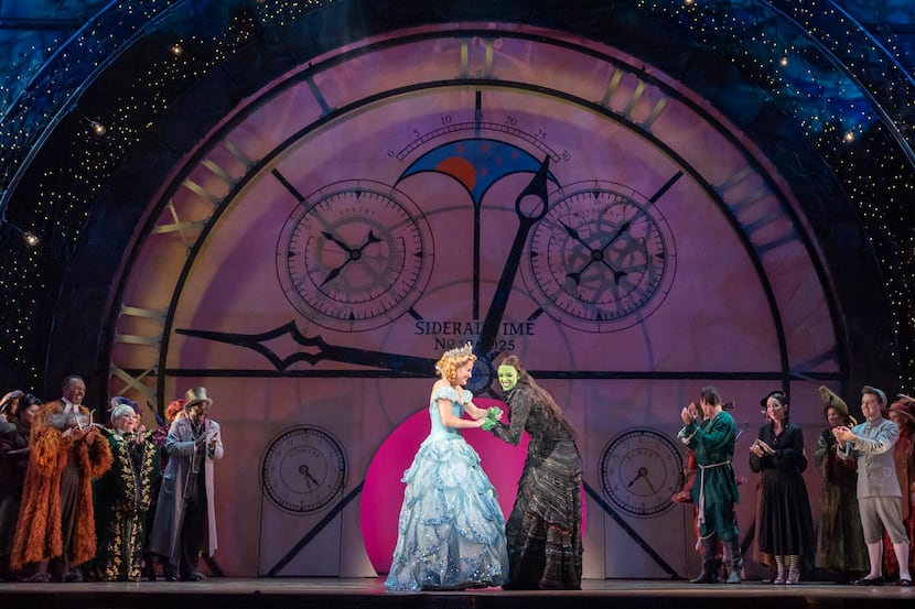 Glinda (Allison Bailey), left, and Elphaba (Talia Suskauer) appear in a curtain call during...